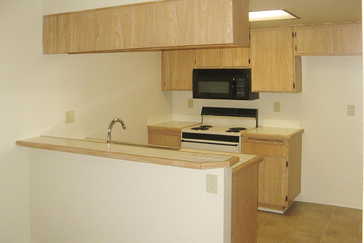 a kitchen with a sink and a refrigerator