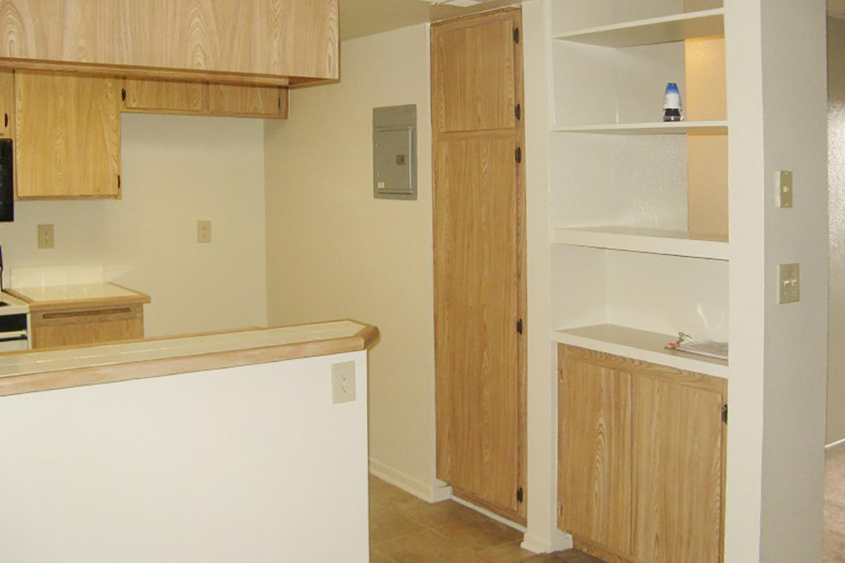 a kitchen with a sink and a refrigerator