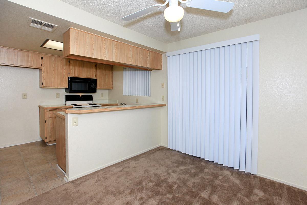 a kitchen with a stove and a refrigerator