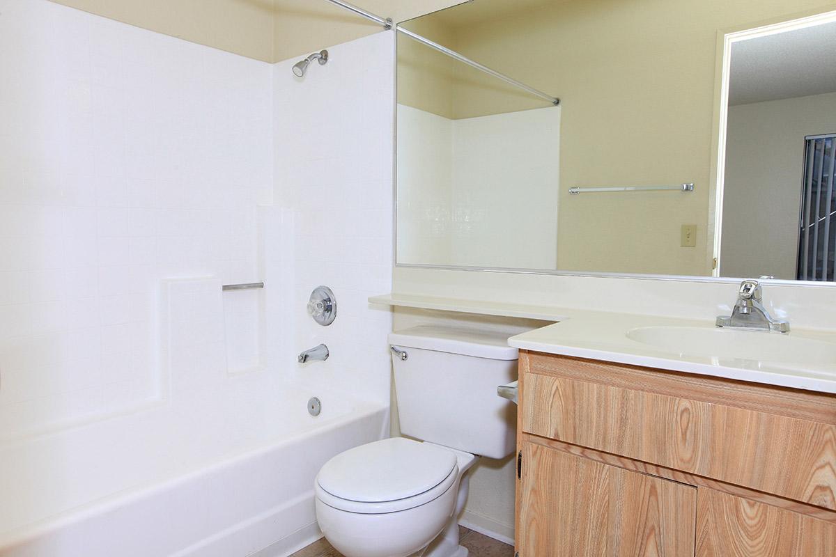 a large white tub sitting next to a sink