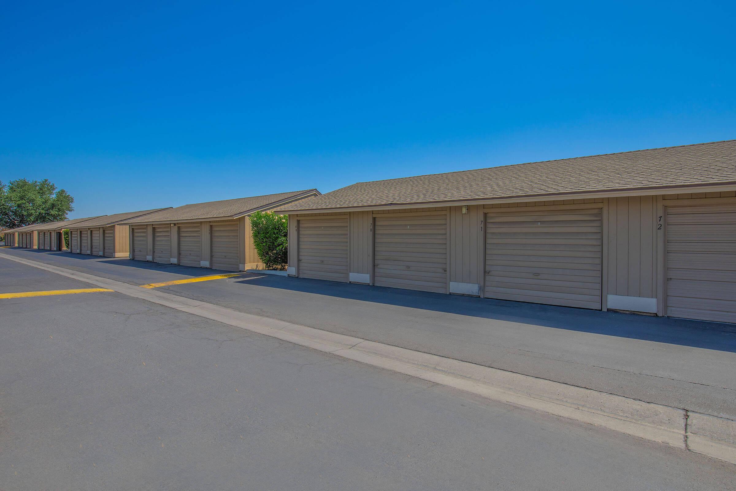 an empty road with a building in the background