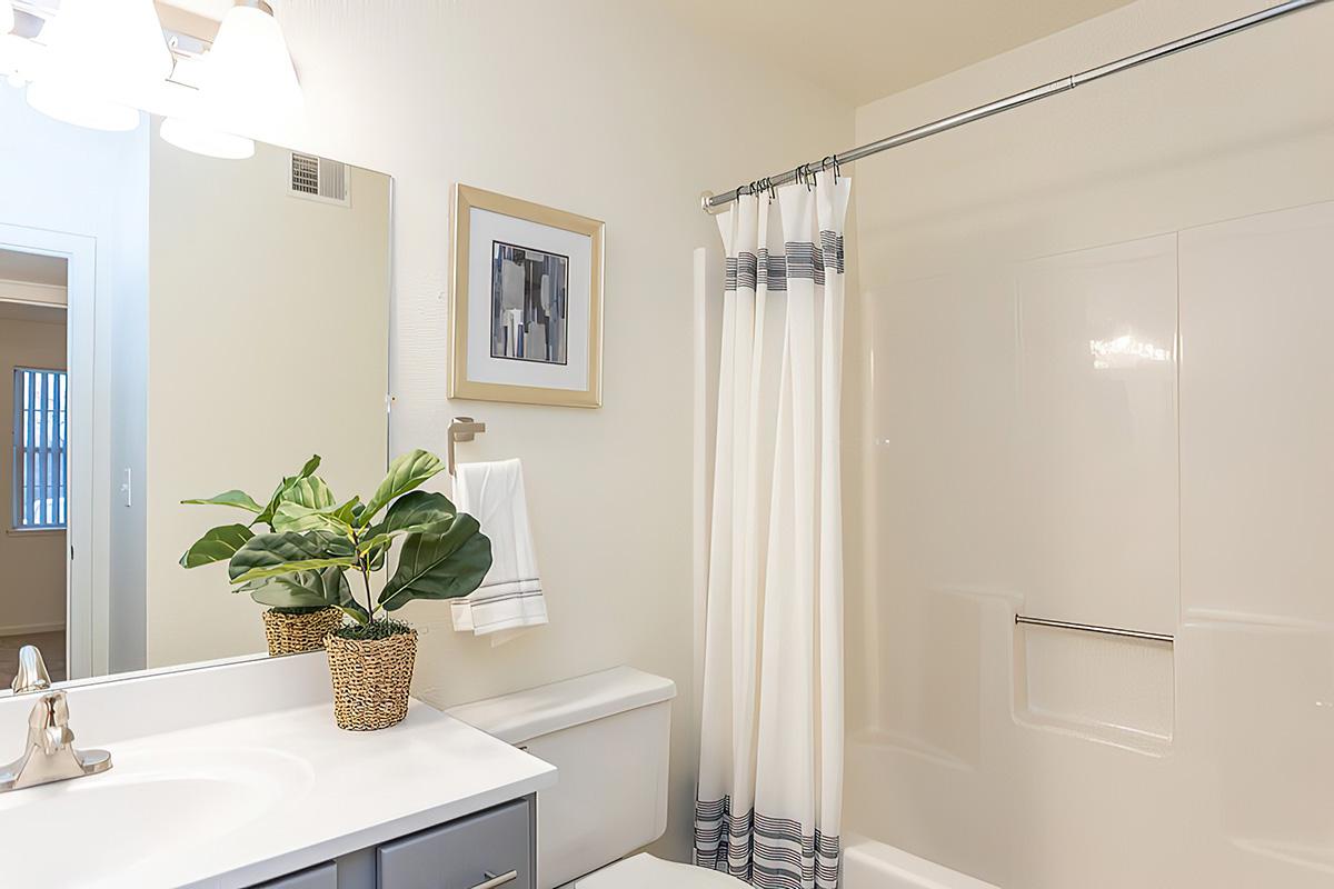 a room with a sink and a mirror