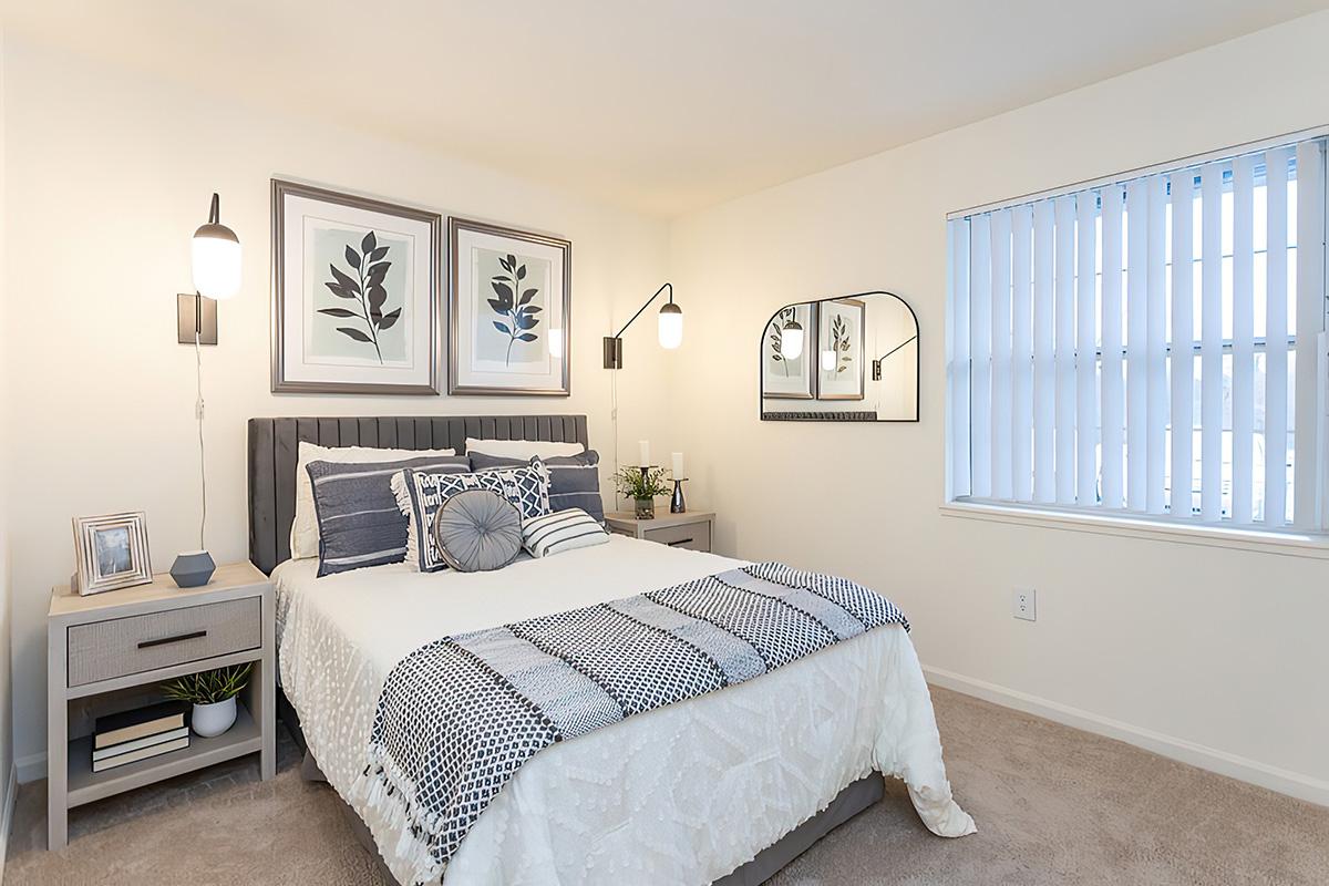 a bedroom with a large bed in a room