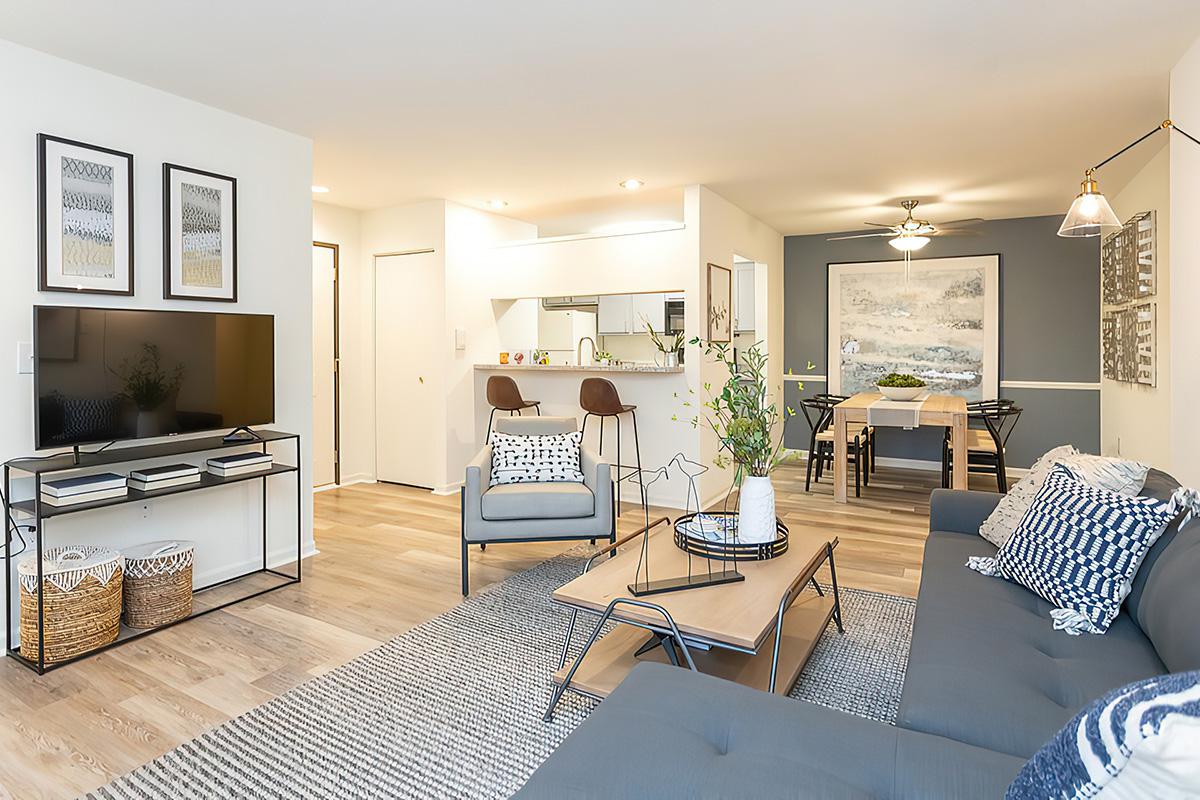 a living room filled with furniture and a fireplace