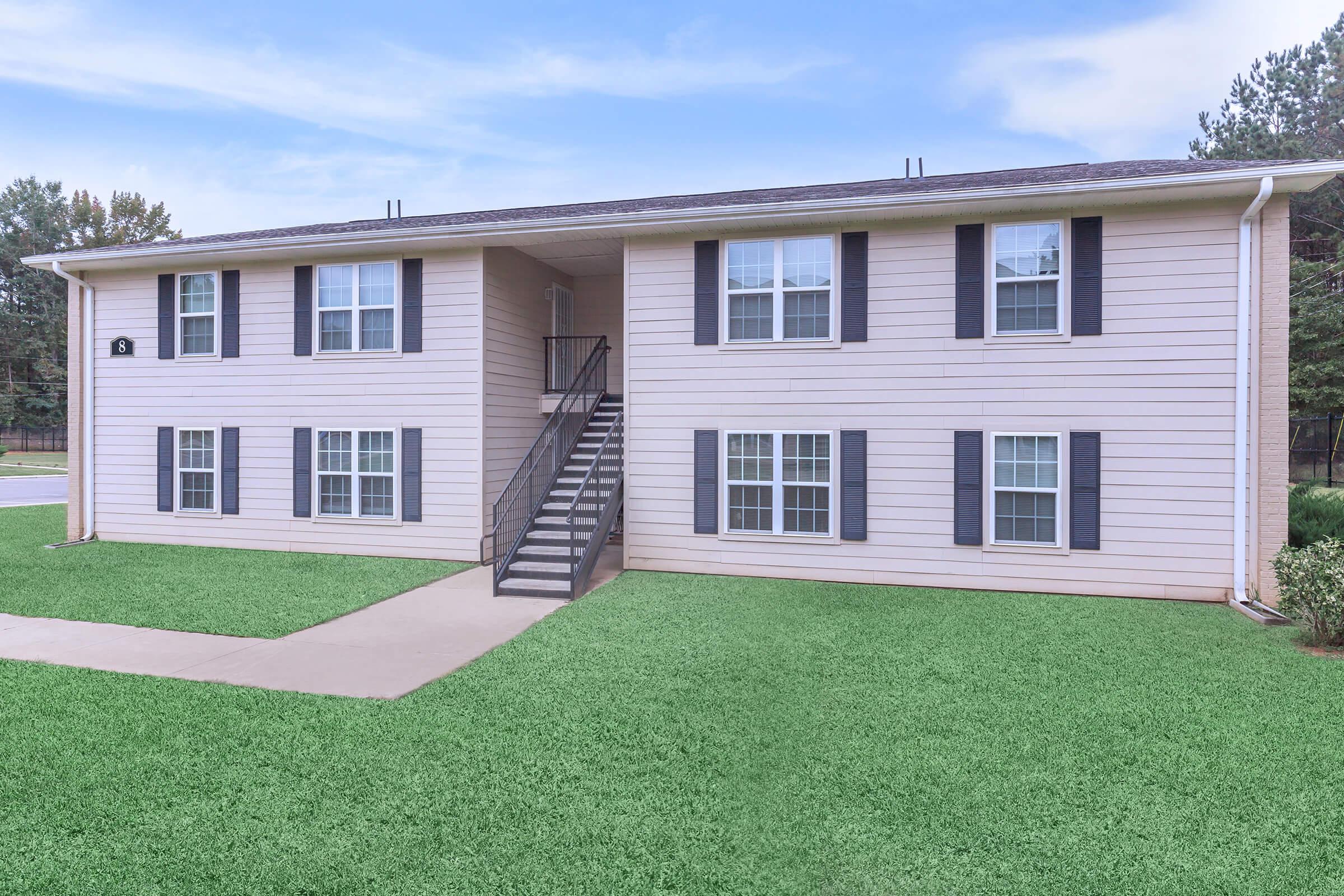 a large lawn in front of a house