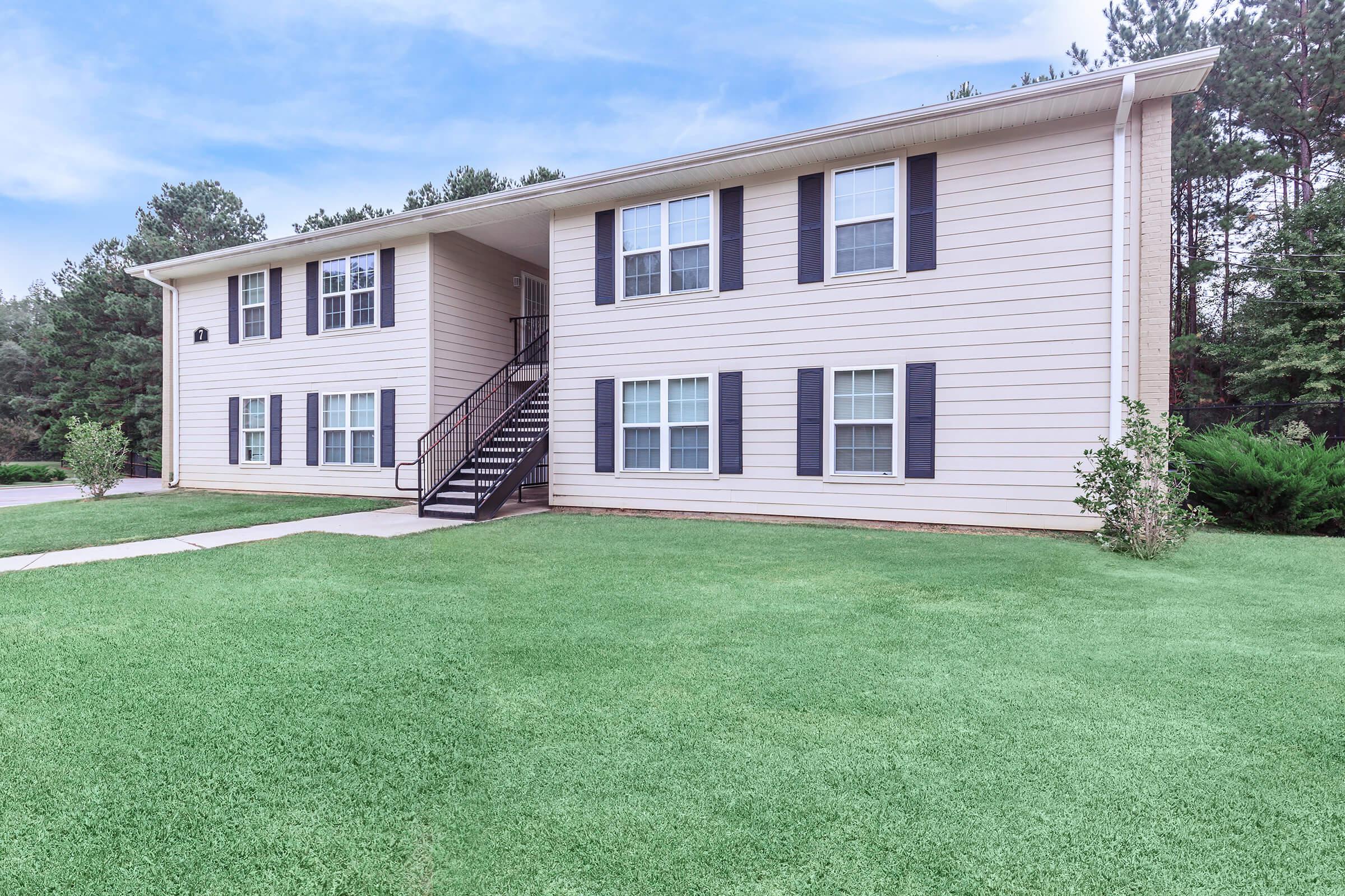 a large lawn in front of a house