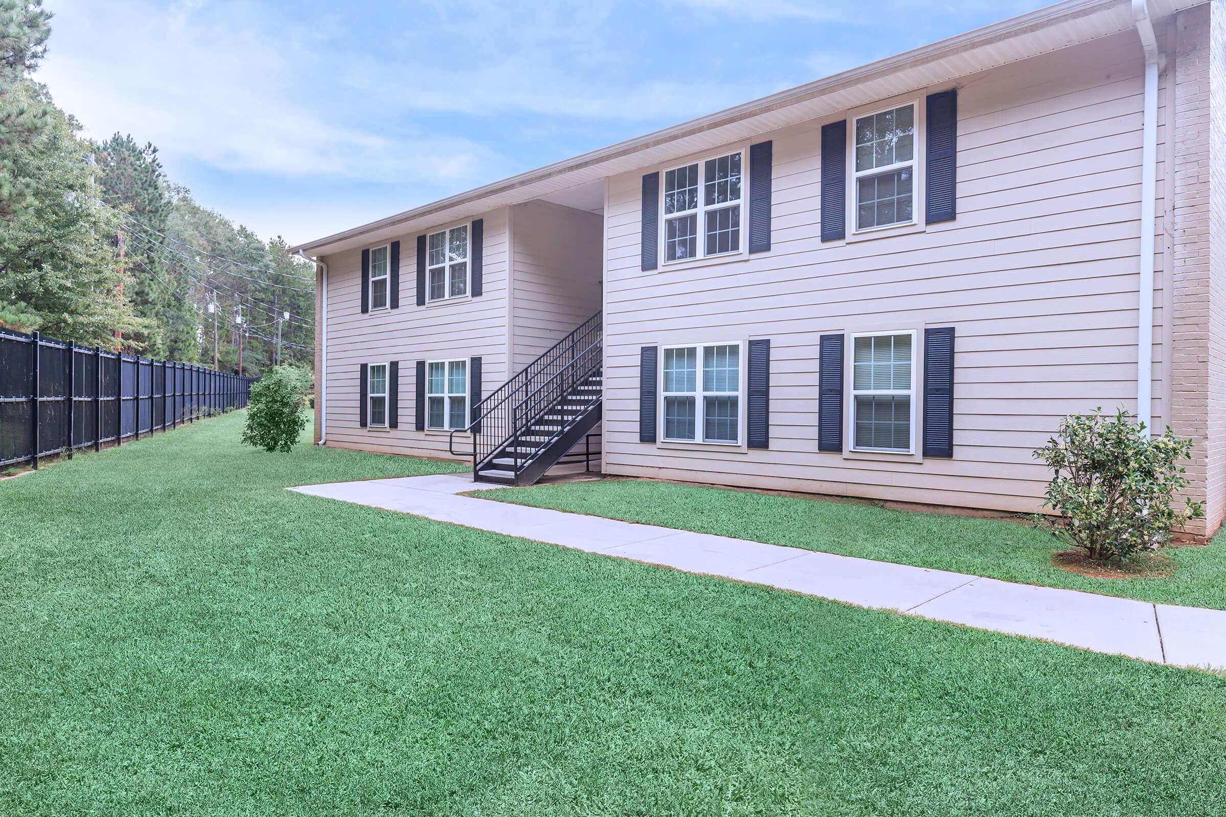 a large lawn in front of a house