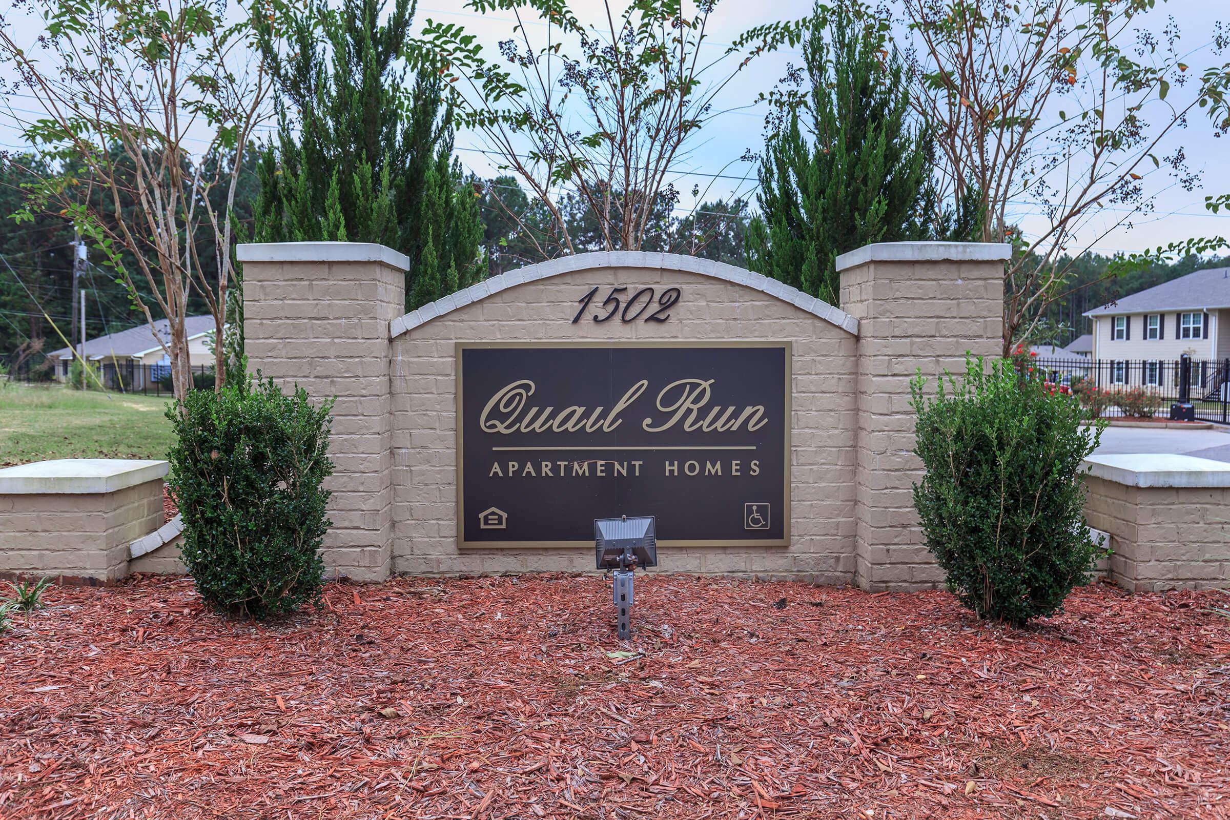 a sign in front of a house