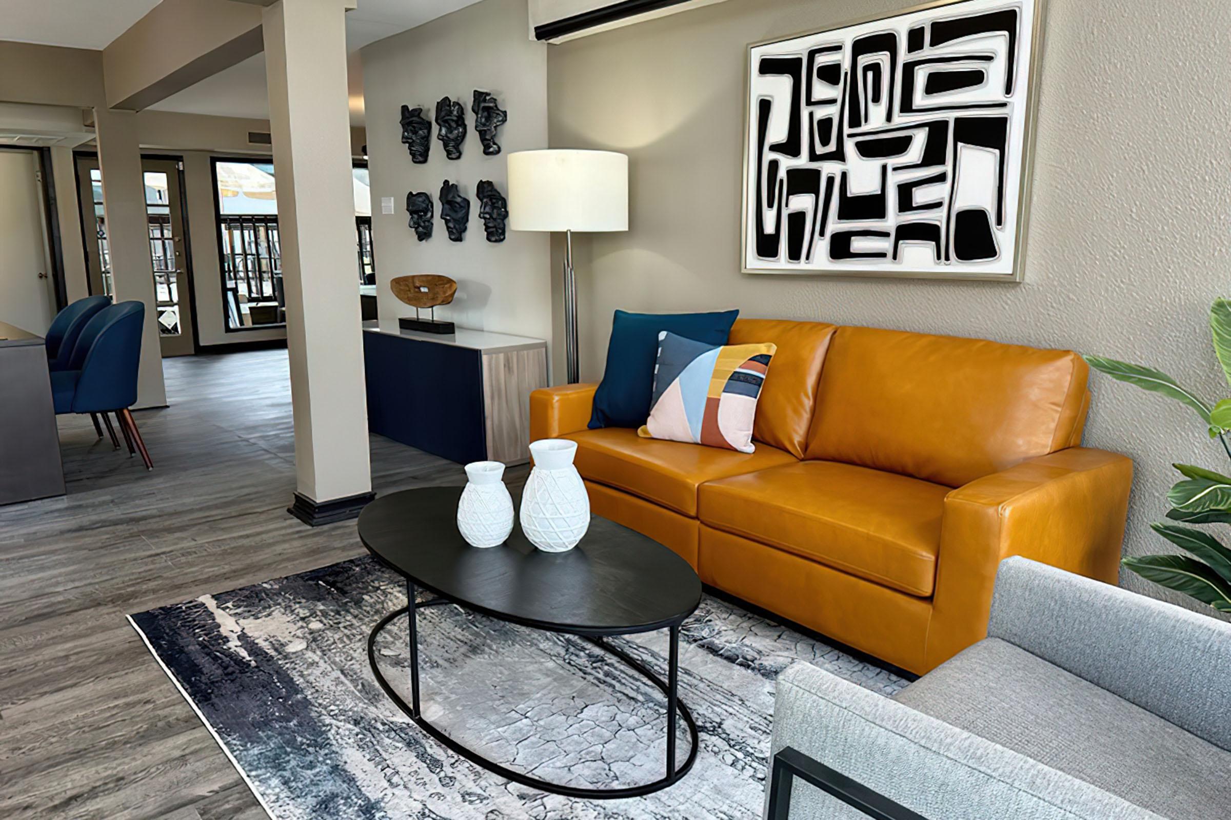 a living room with a leather chair