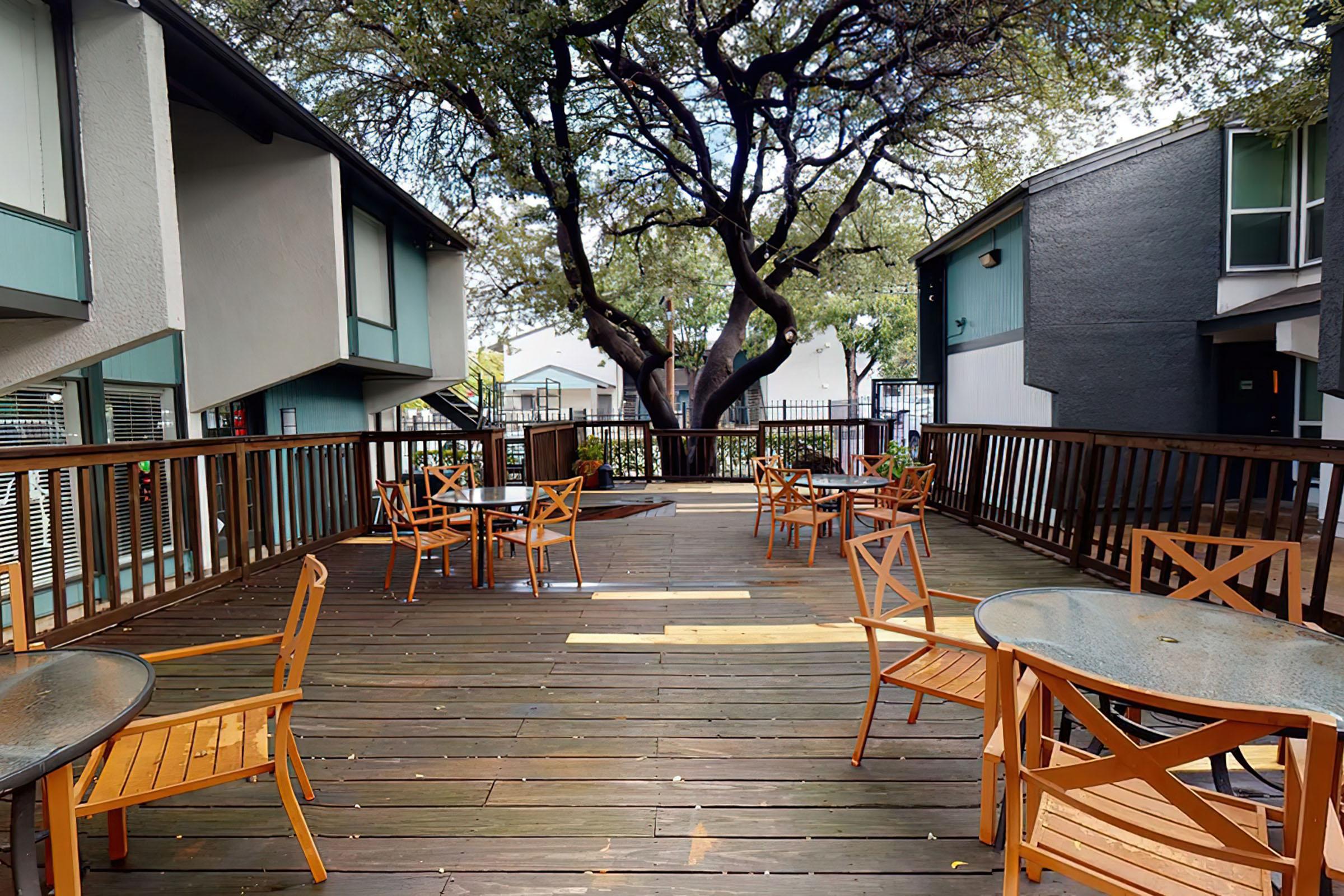 a wooden bench sitting in front of a building