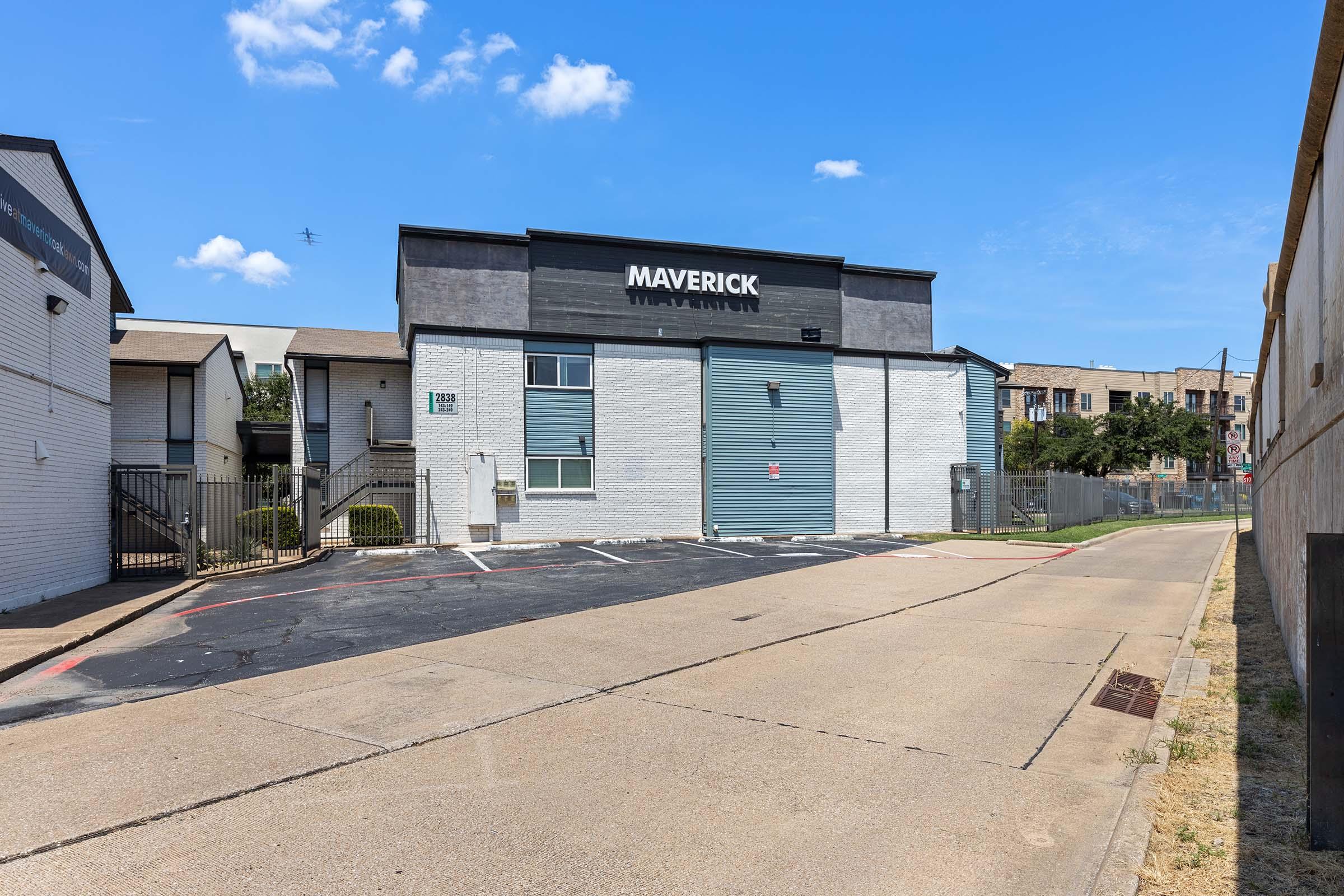 a train is parked on the side of a building