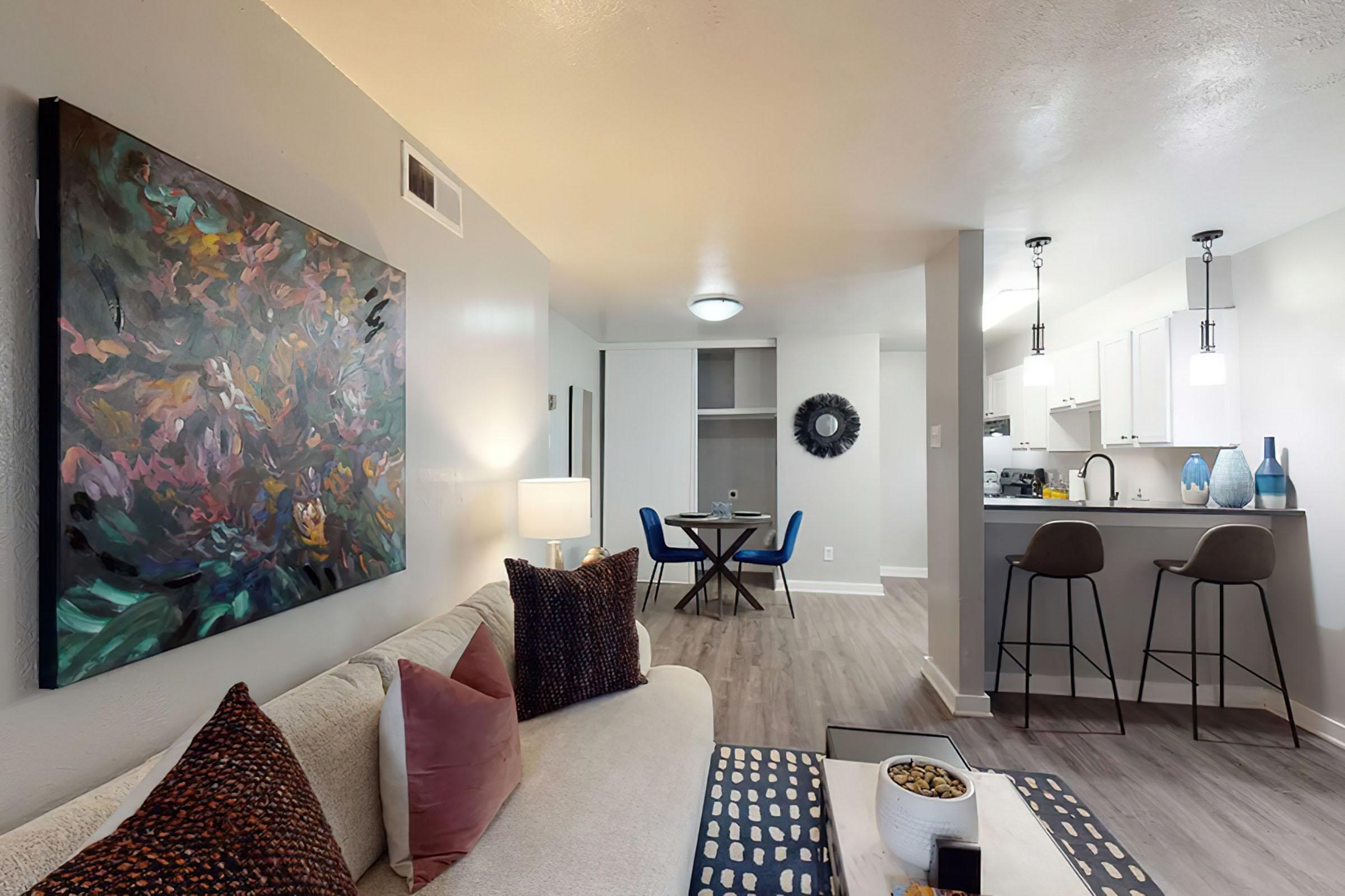 a living room filled with furniture and a flat screen tv