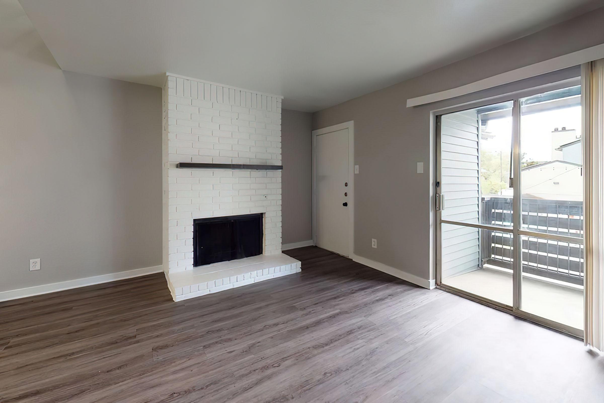 a large empty room with a wooden floor