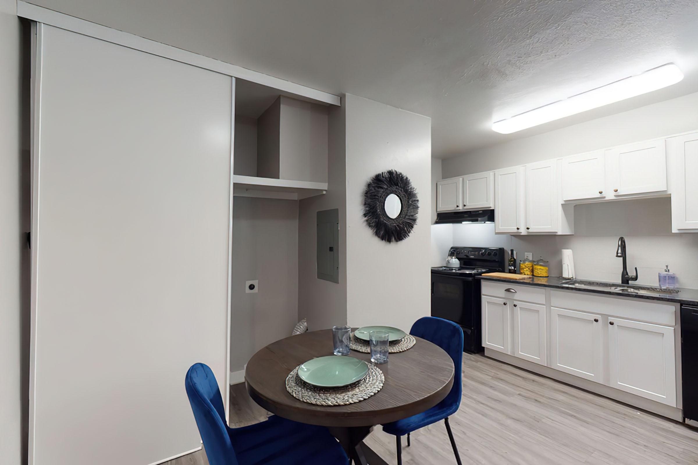 a kitchen with a table in a room