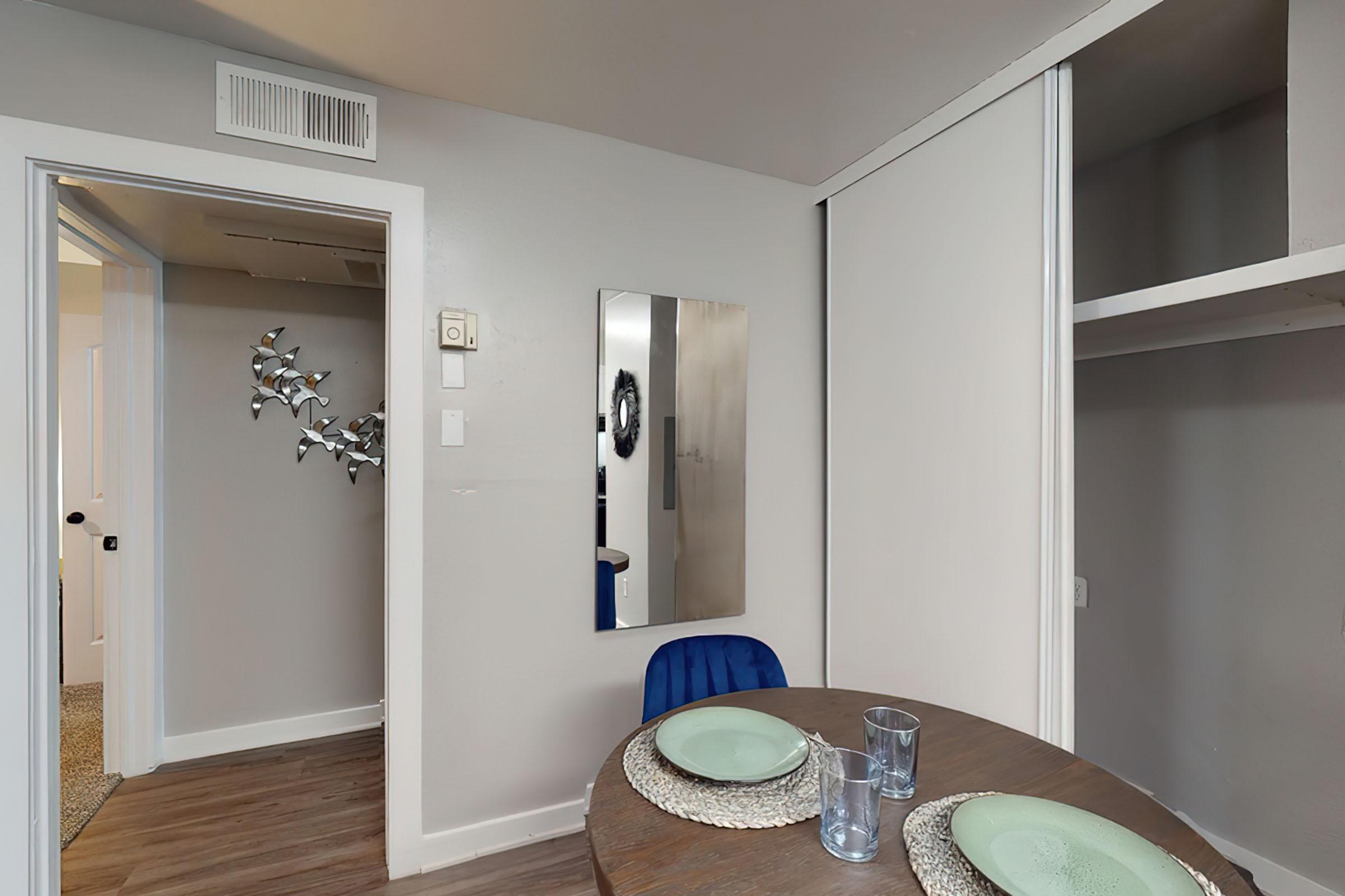 a living room with a sink and a mirror