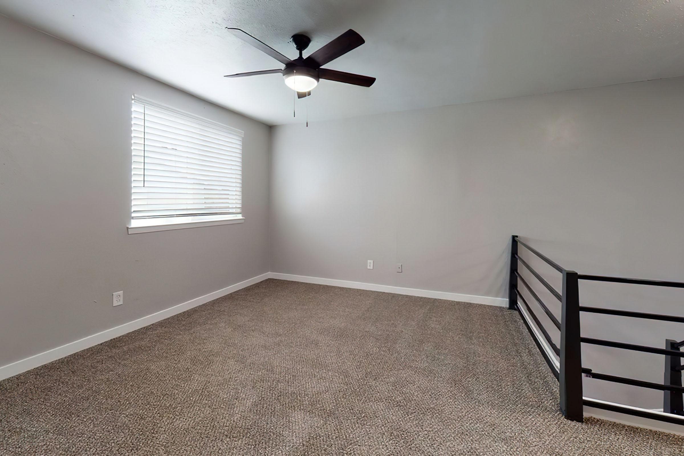 a bedroom with a large window