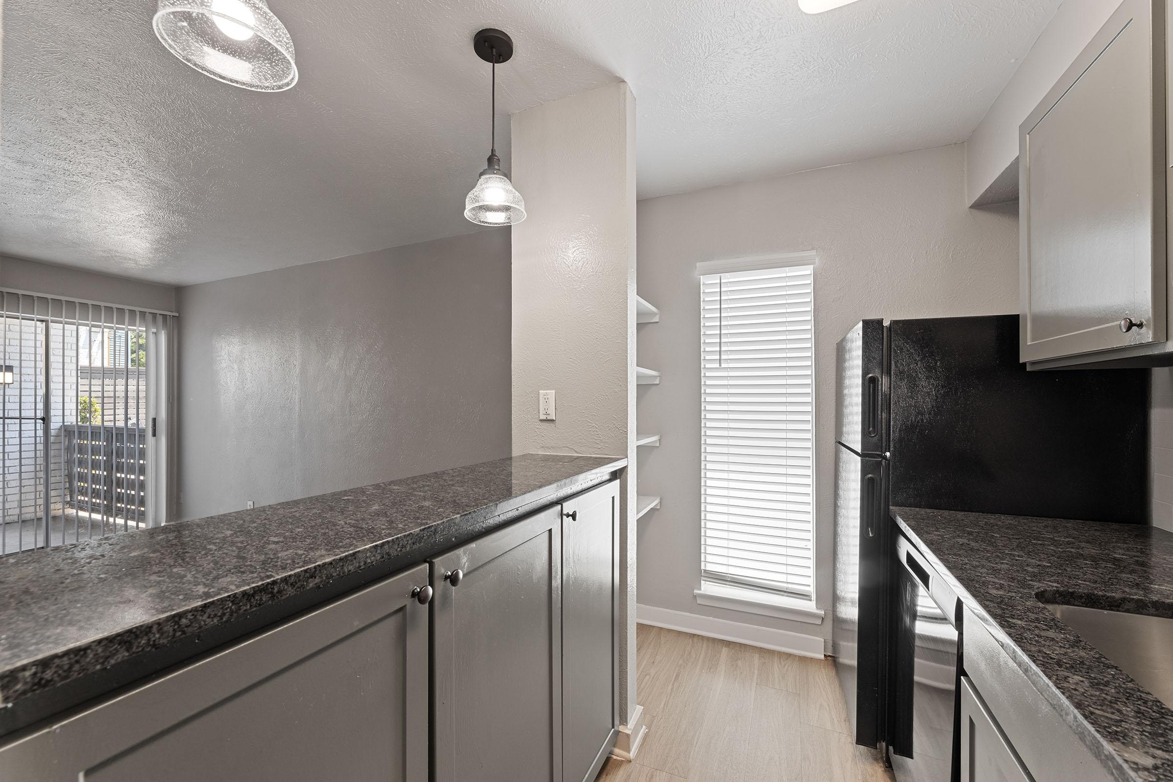 a kitchen with a sink and a window