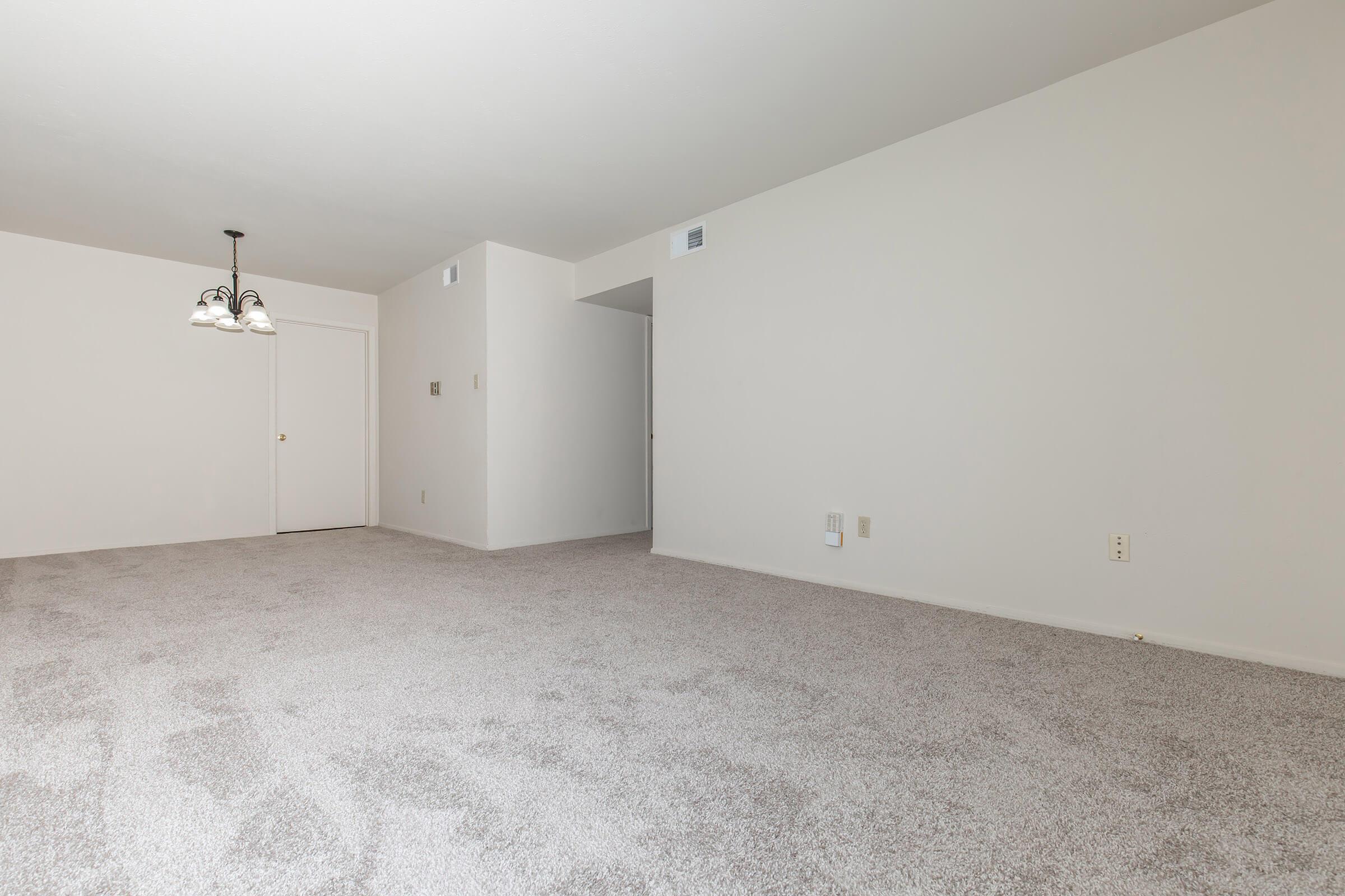 a bedroom with a bed in a room