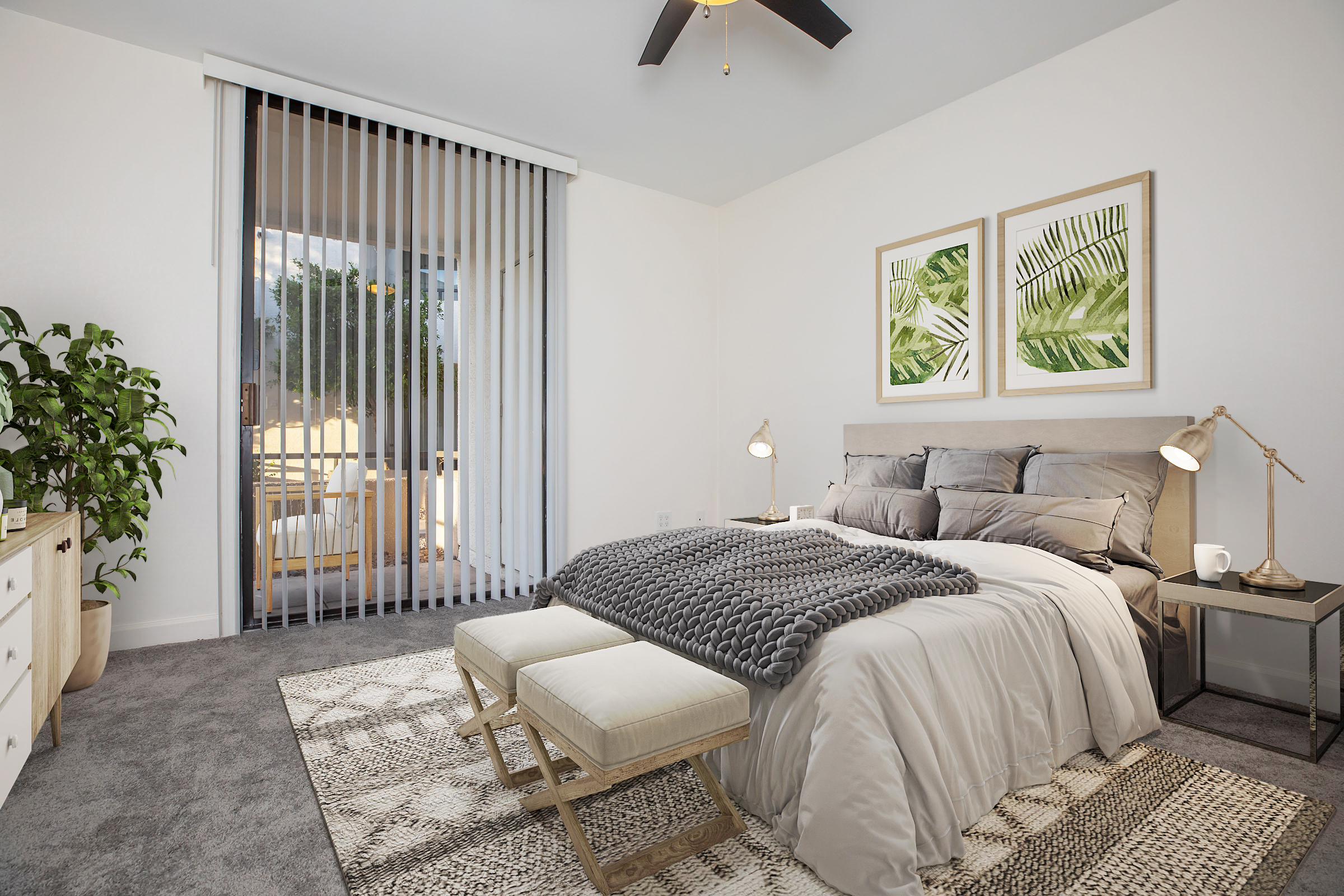 A modern bedroom featuring a queen-sized bed with gray bedding, two decorative pillows, and a knitted throw. There are two bedside lamps on nightstands, a potted plant, and a large window covered by vertical blinds. The walls are adorned with framed botanical prints, and a cozy rug is placed on the floor.