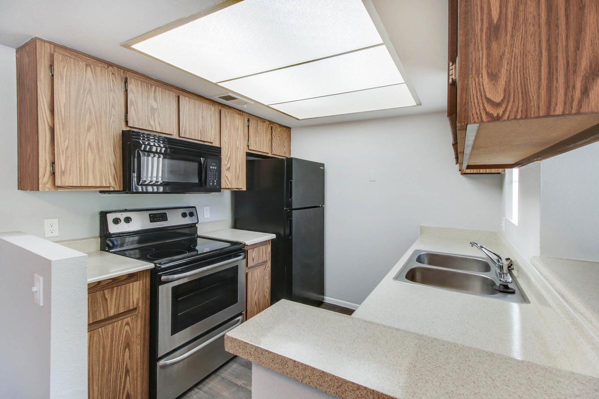 a kitchen with a stove top oven