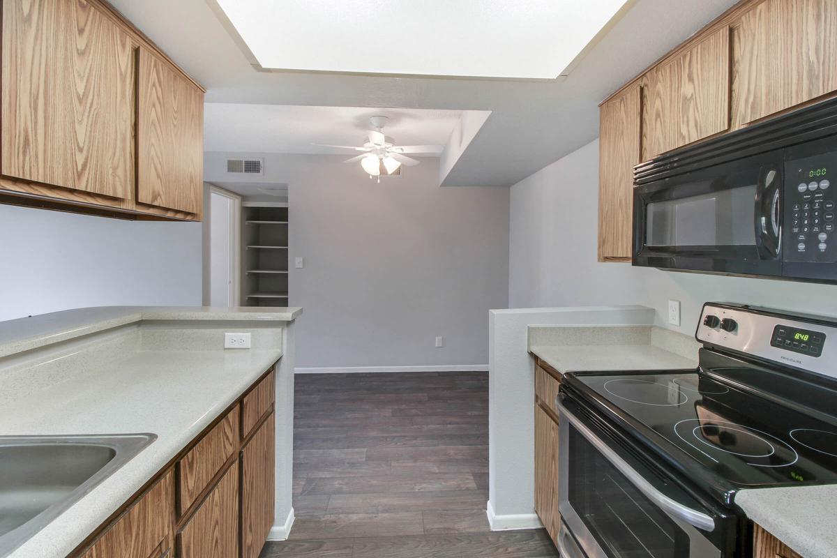 a kitchen with a stove top oven
