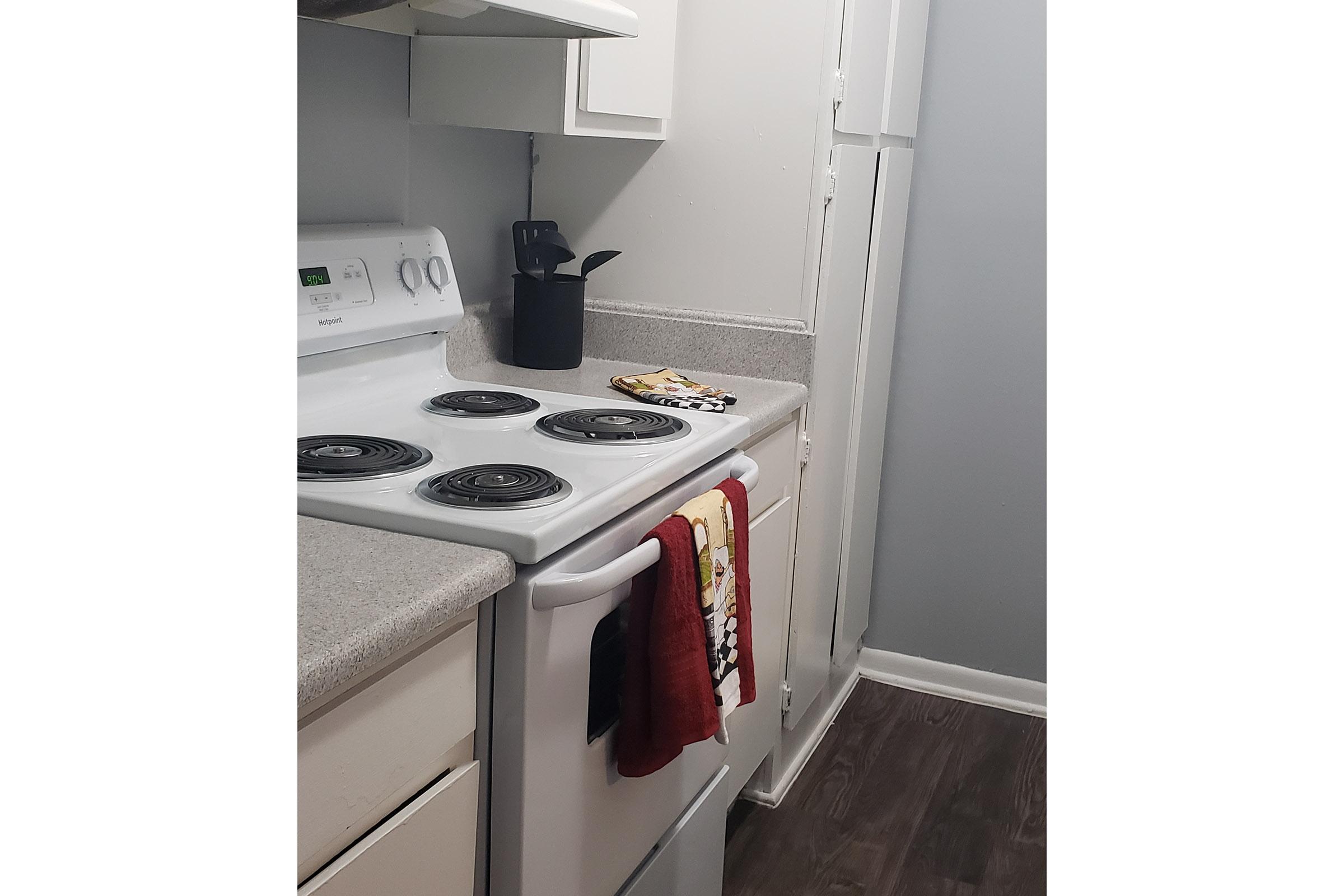 a kitchen with a stove top oven sitting inside of a refrigerator