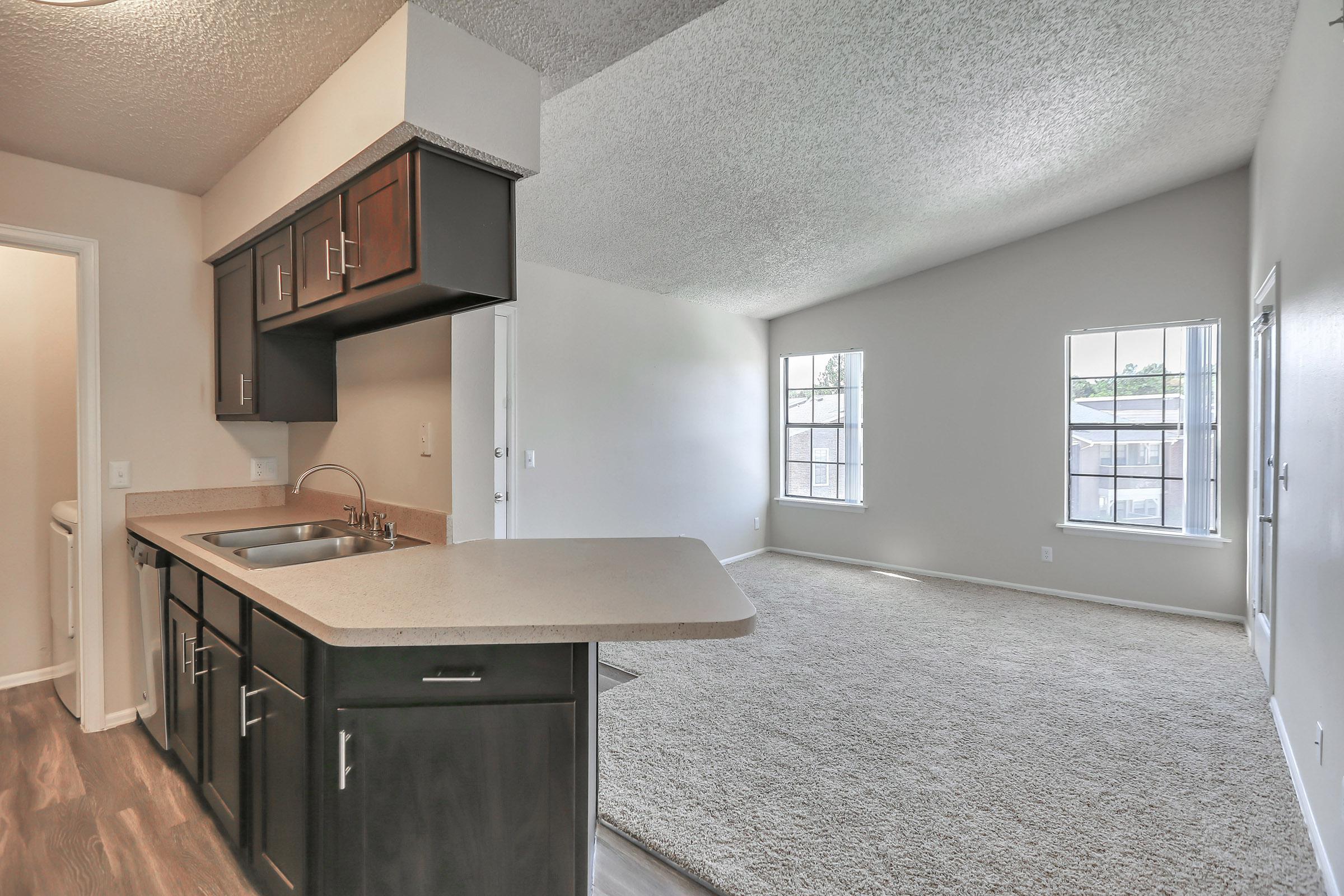 a kitchen with an island in the middle of a room
