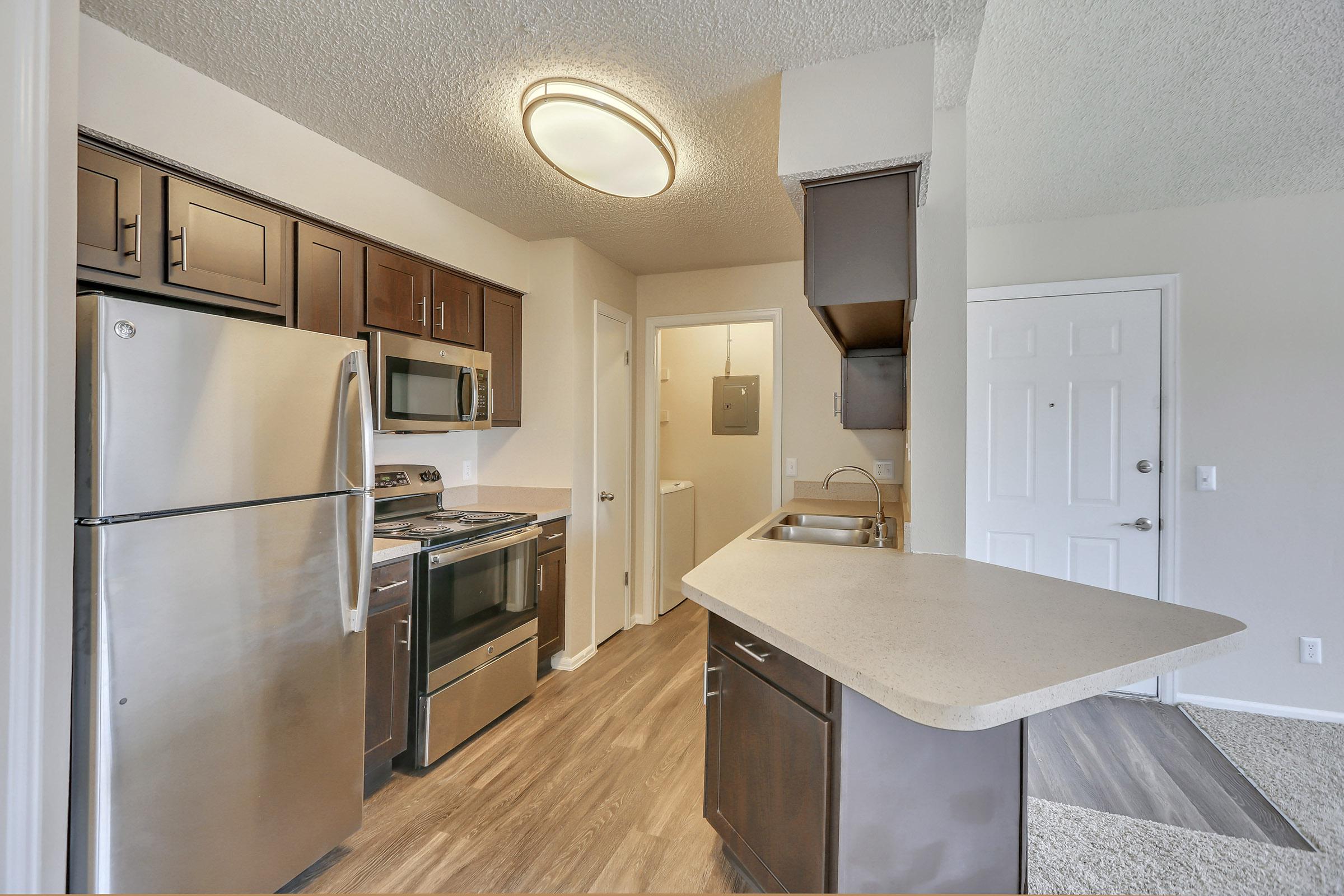 a stainless steel refrigerator in a kitchen