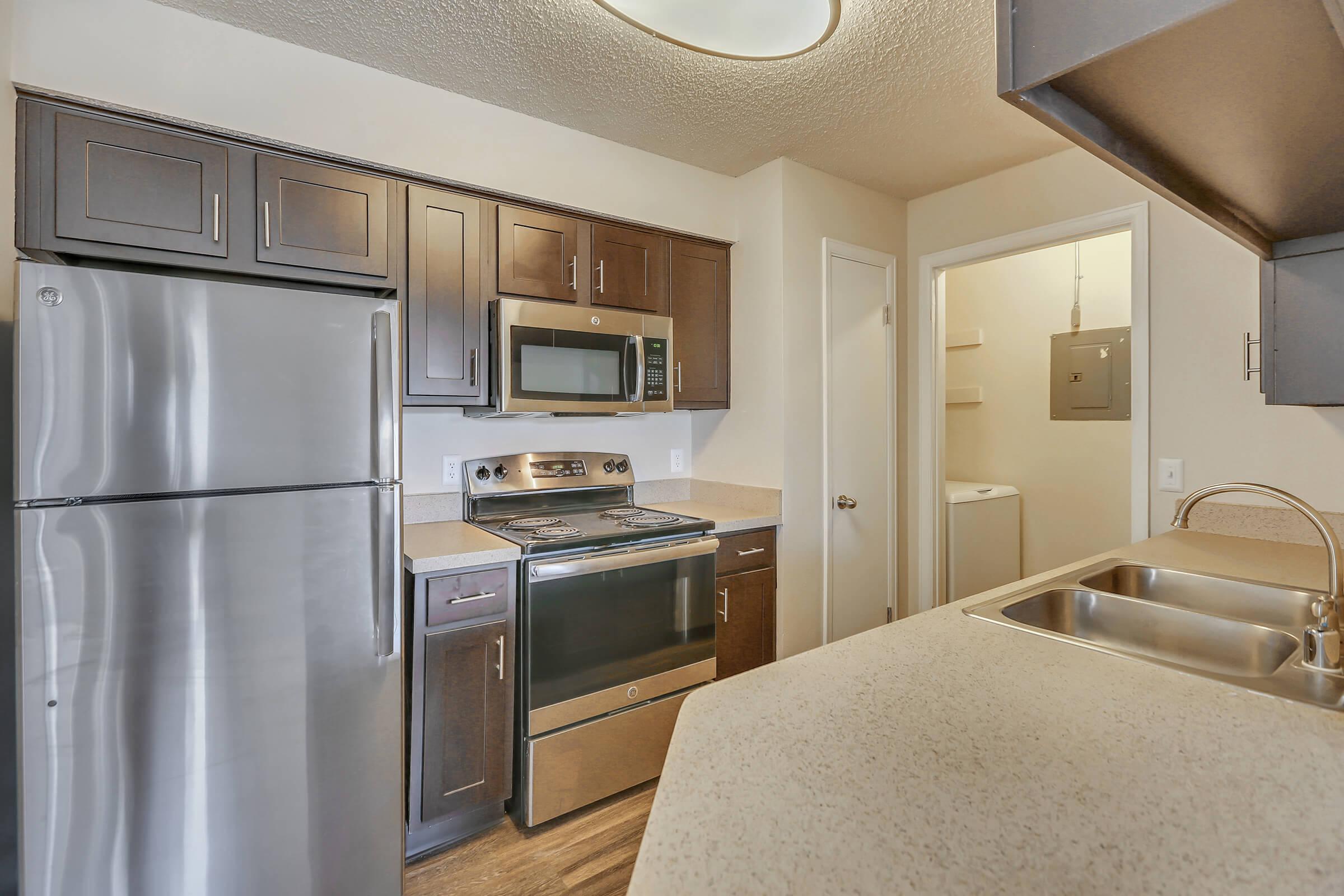 a stainless steel refrigerator in a kitchen