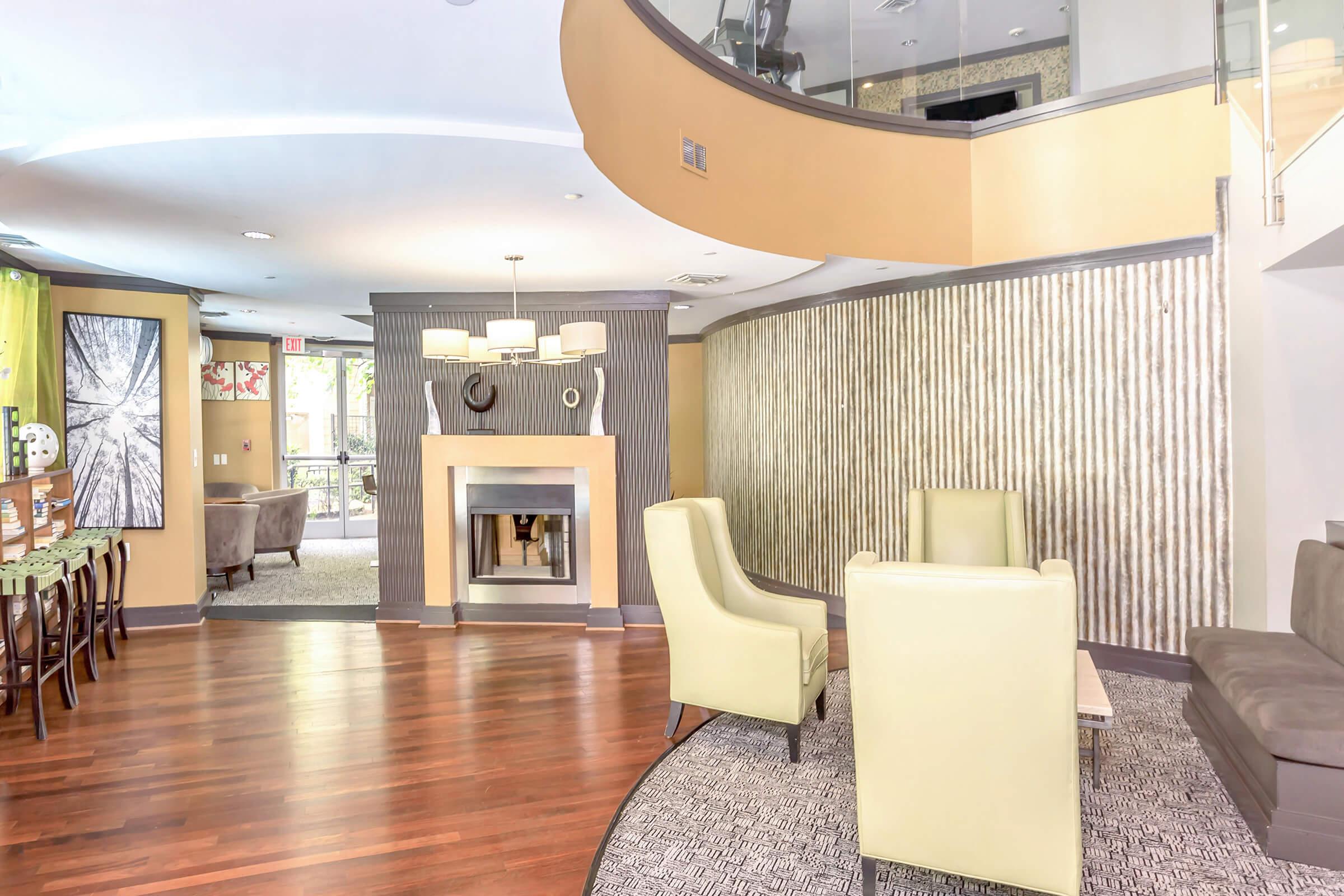 a living room filled with furniture and a fireplace