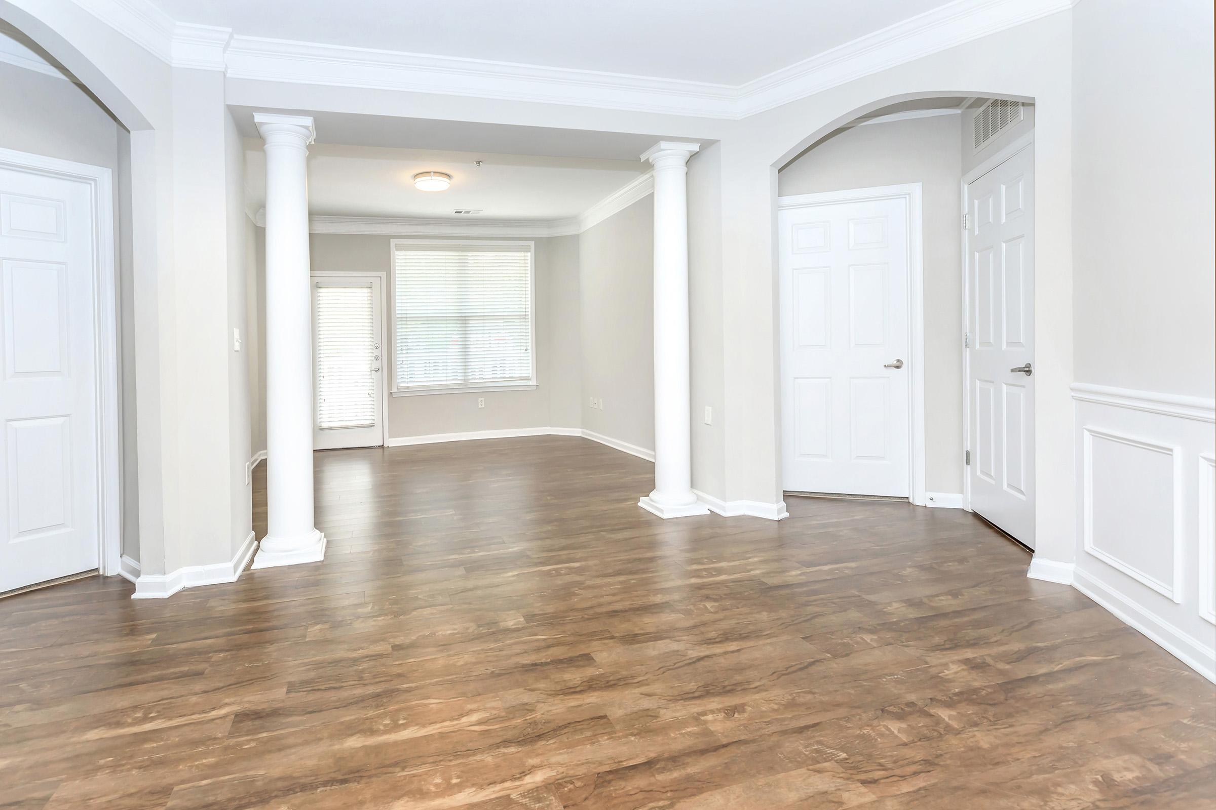 a room filled with furniture and a large window