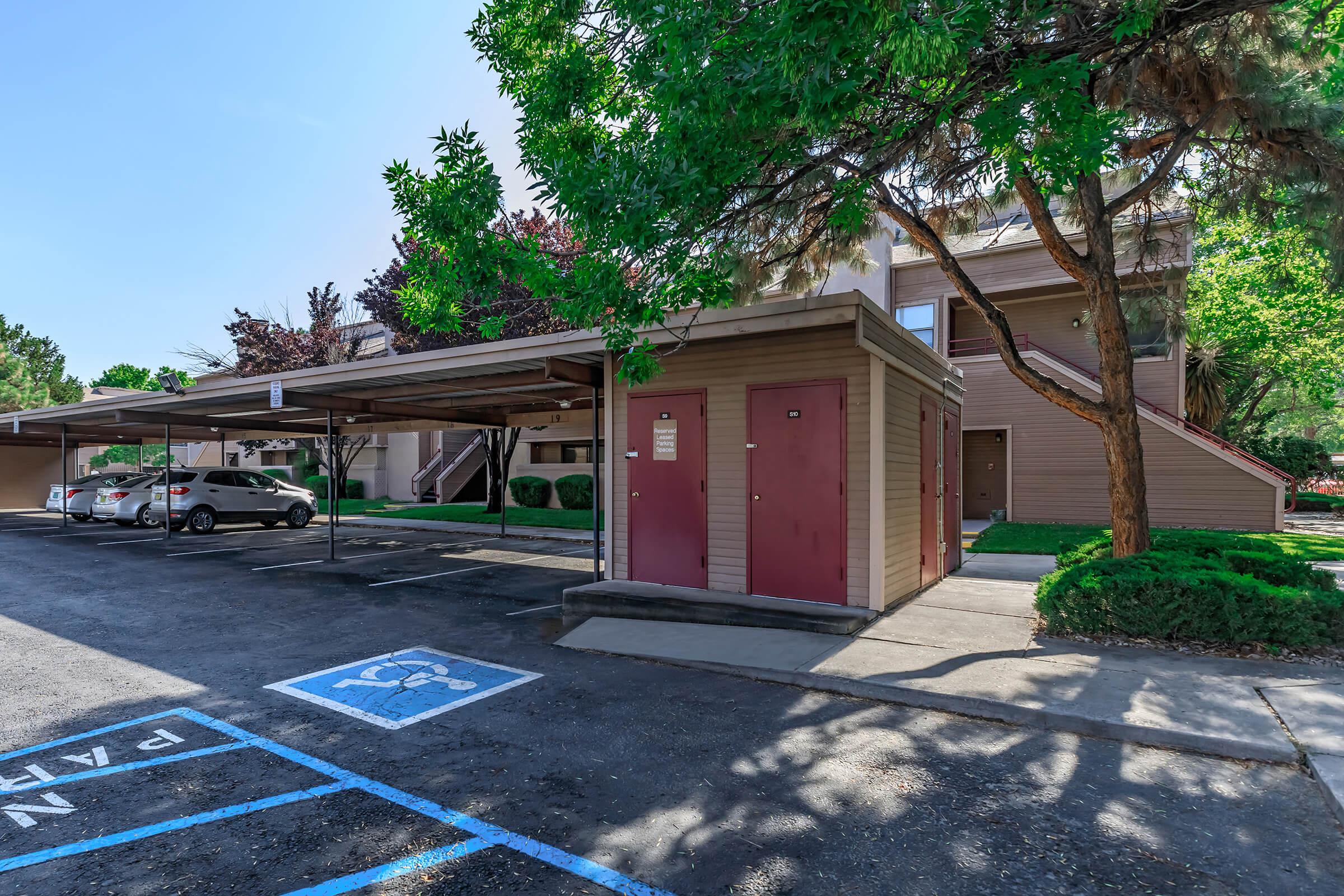 covered parking spots in front of the a community building