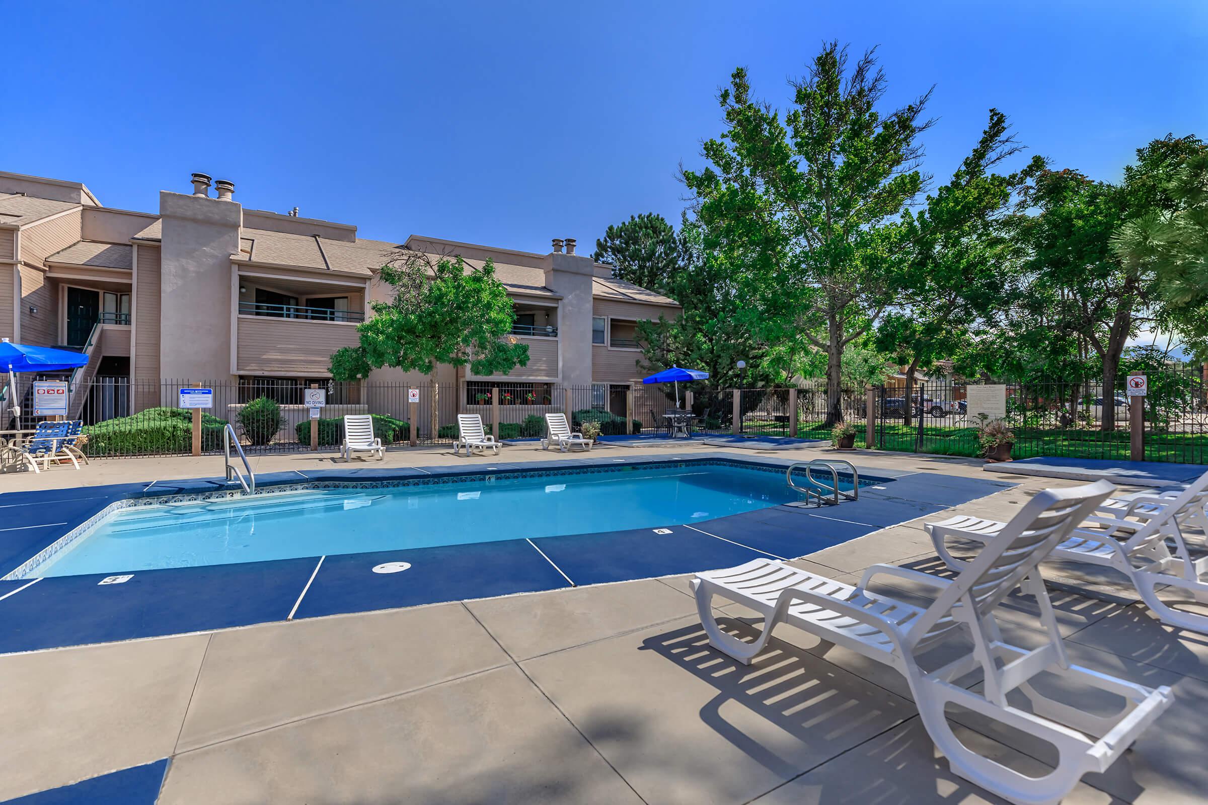 Sunchase community pool with green trees