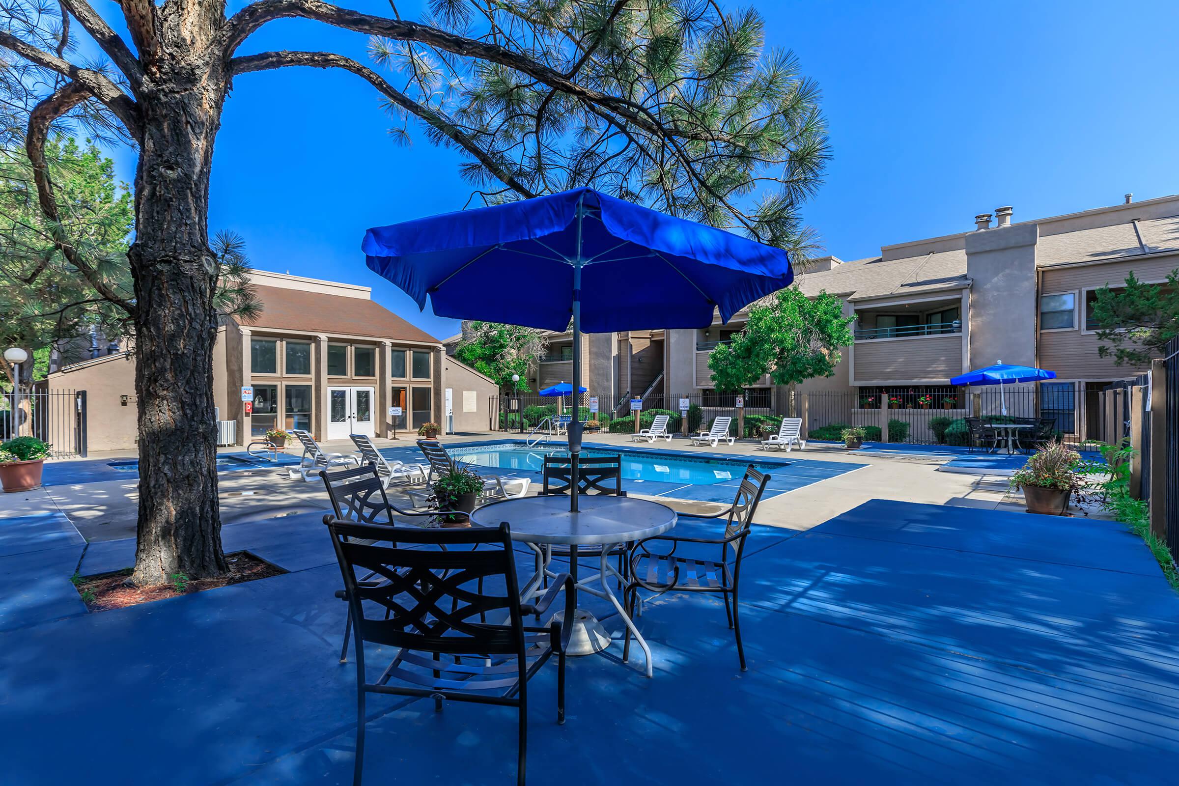 Sunchase community pool with a blue umbrella