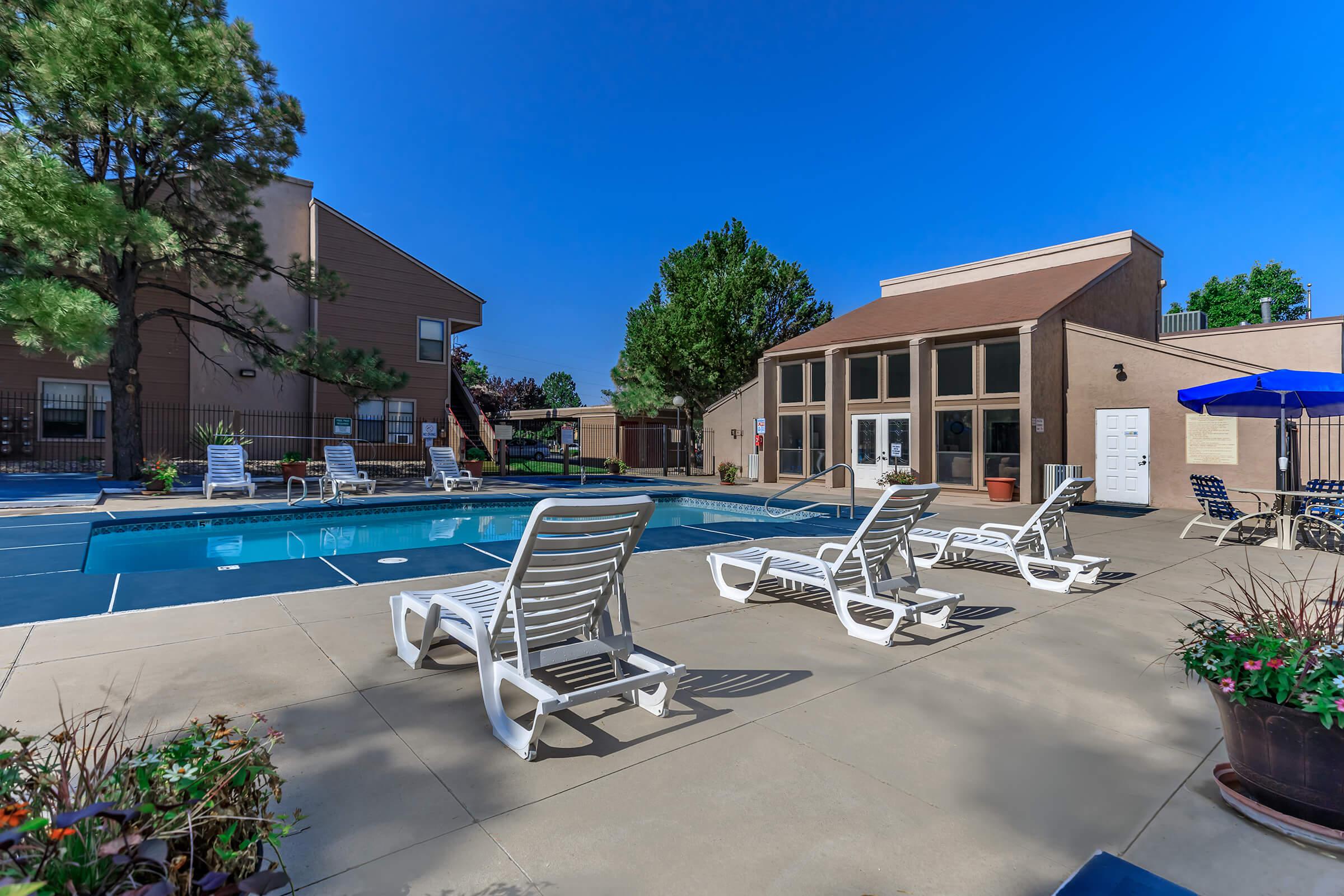 Sunchase community pool with white loungers