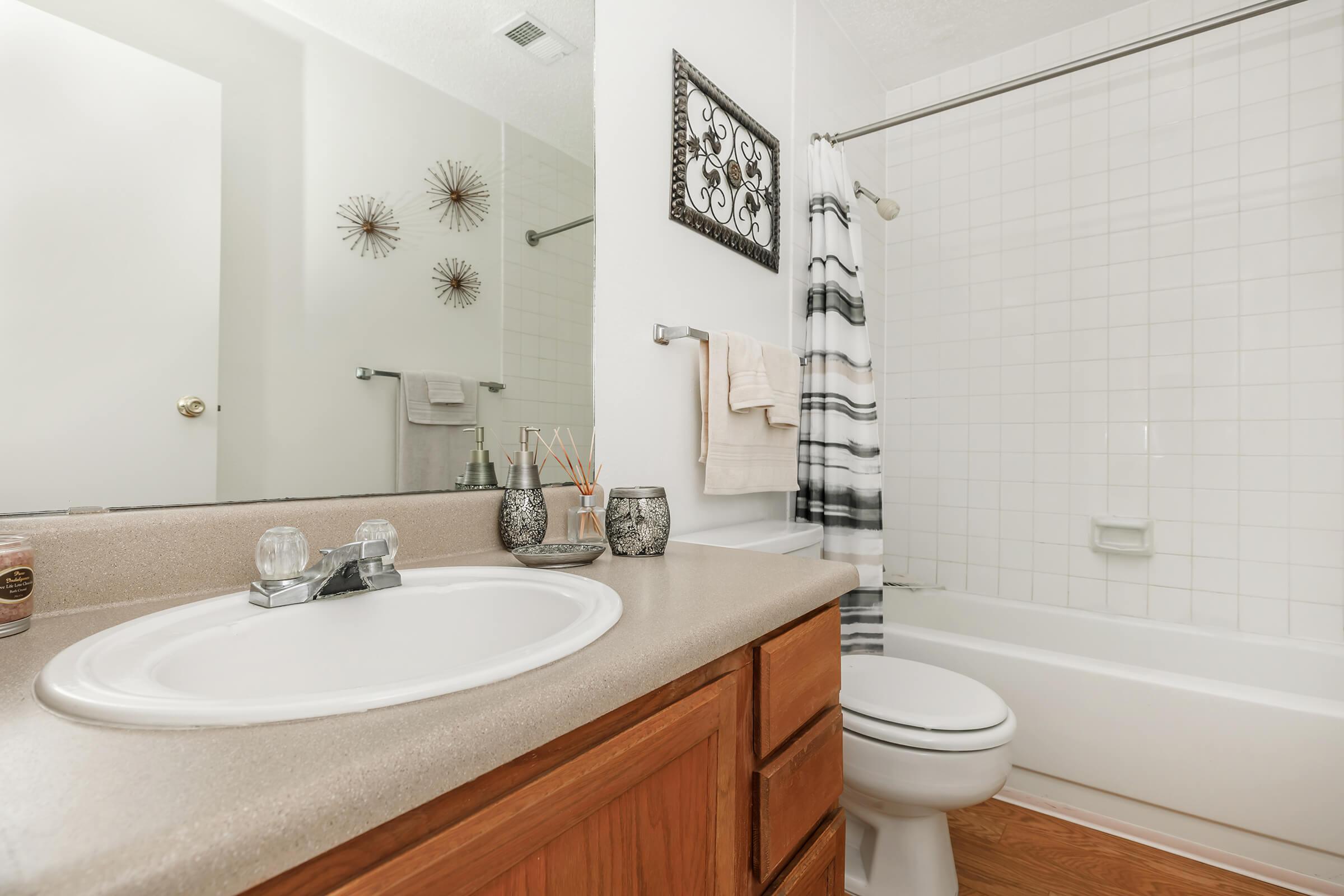 bathroom with wooden cabinets