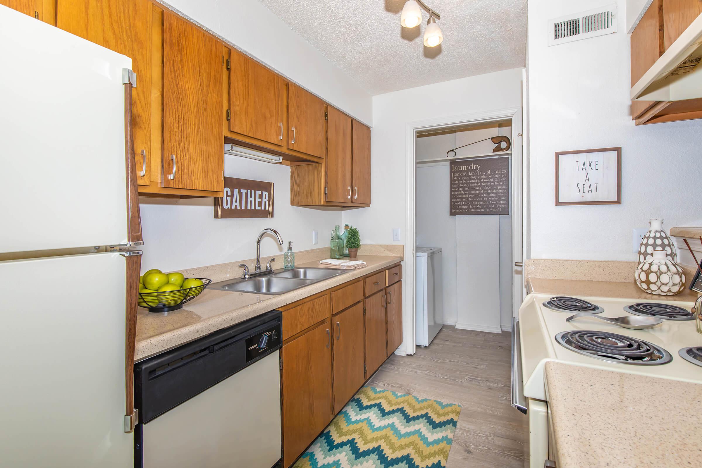 a kitchen with a stove and a refrigerator