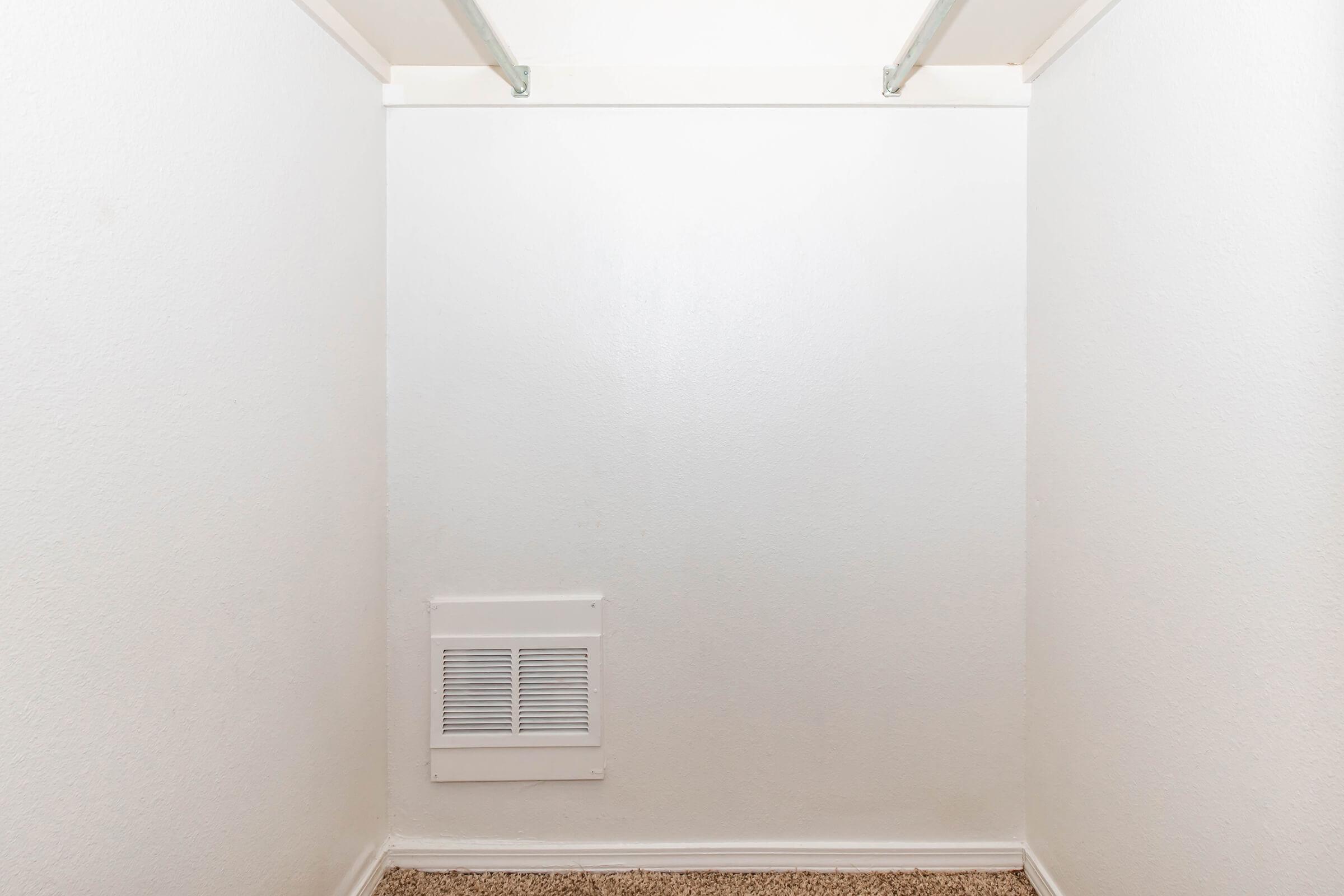 a white refrigerator freezer sitting in a room