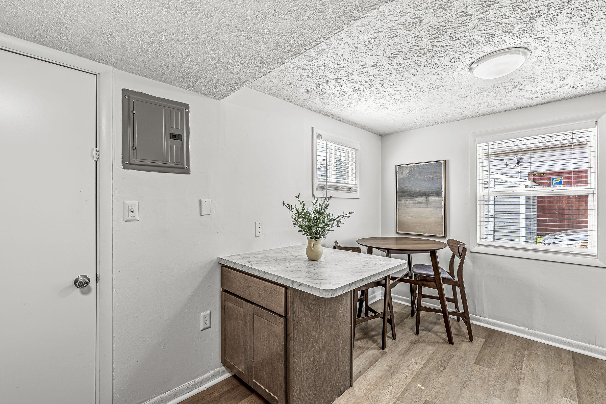 a room filled with furniture and a large window