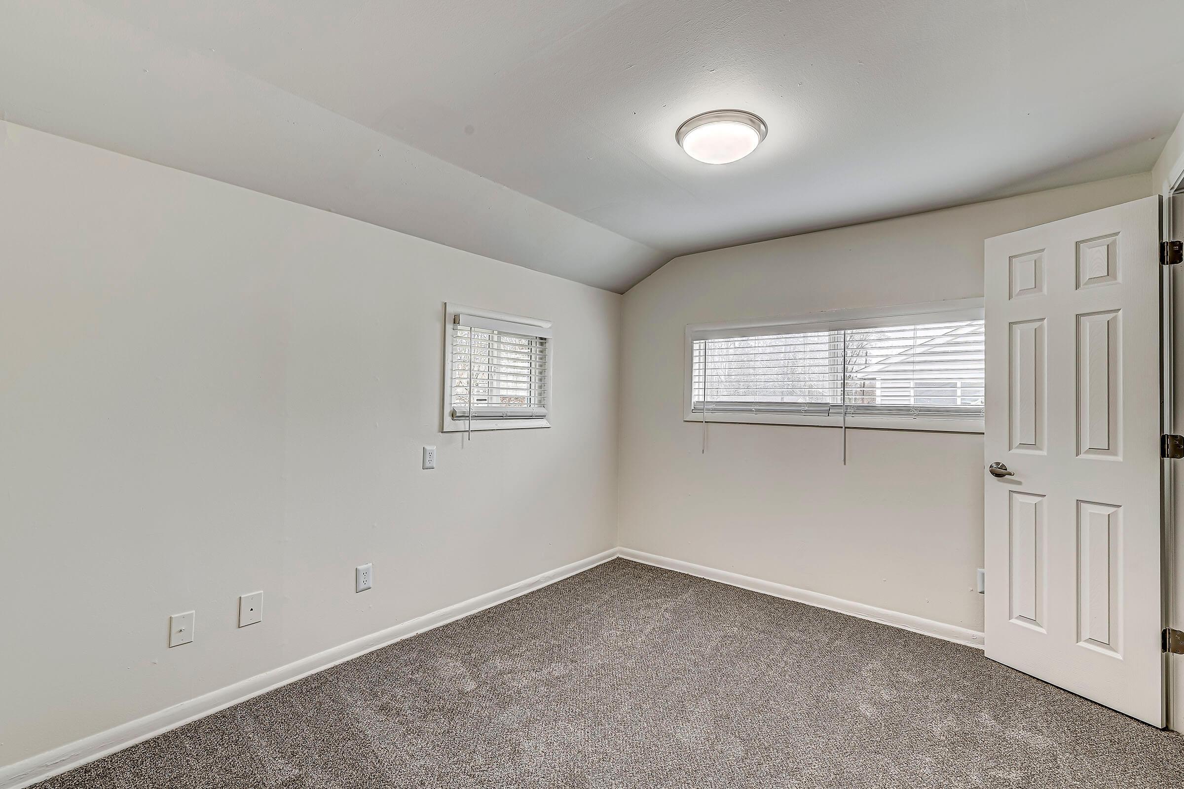 a bedroom with a large mirror