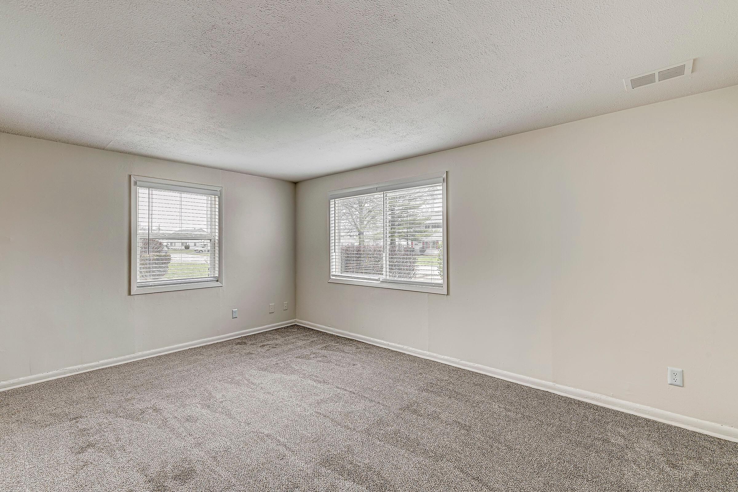 a bedroom with a large mirror