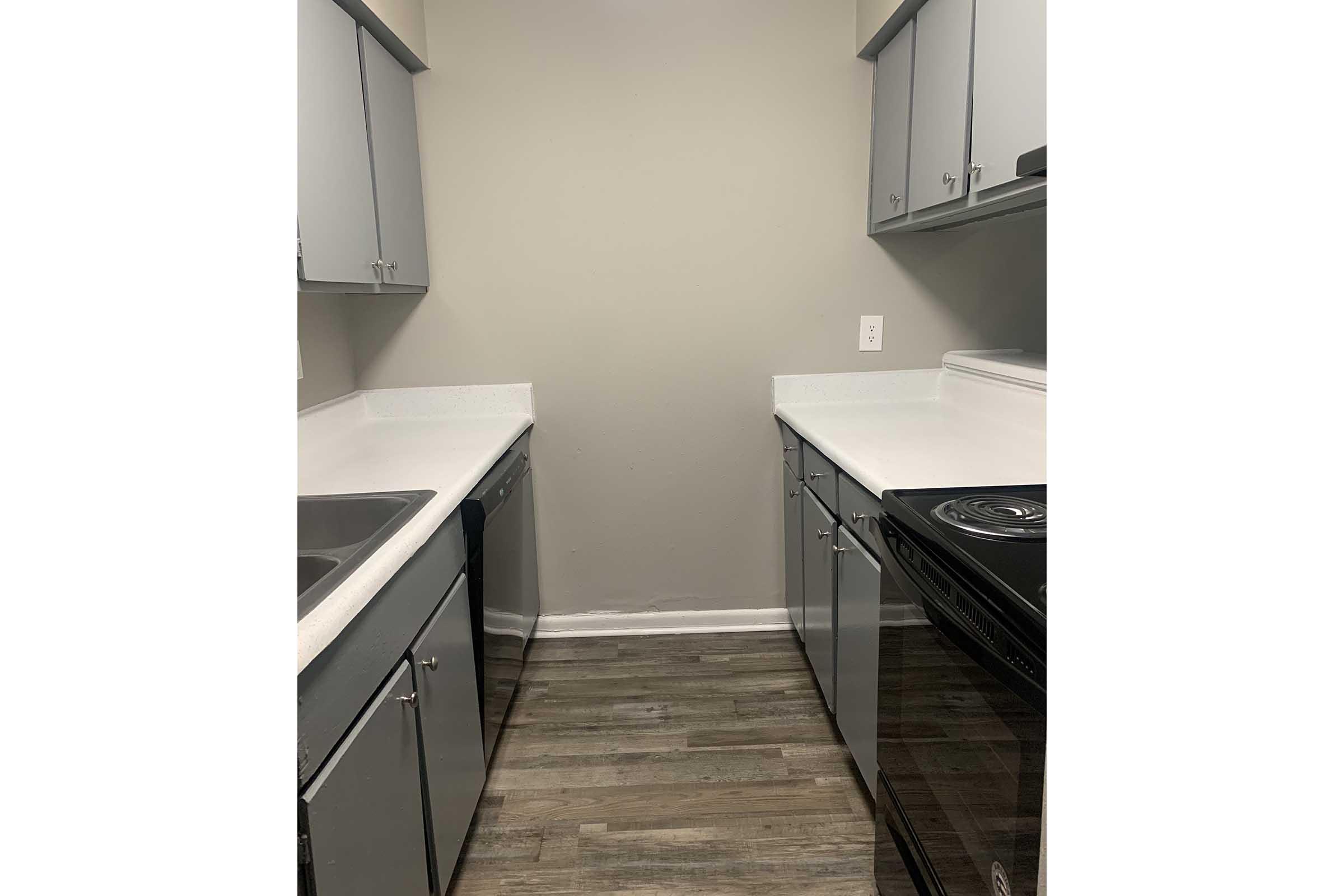 a kitchen with a stove and a sink