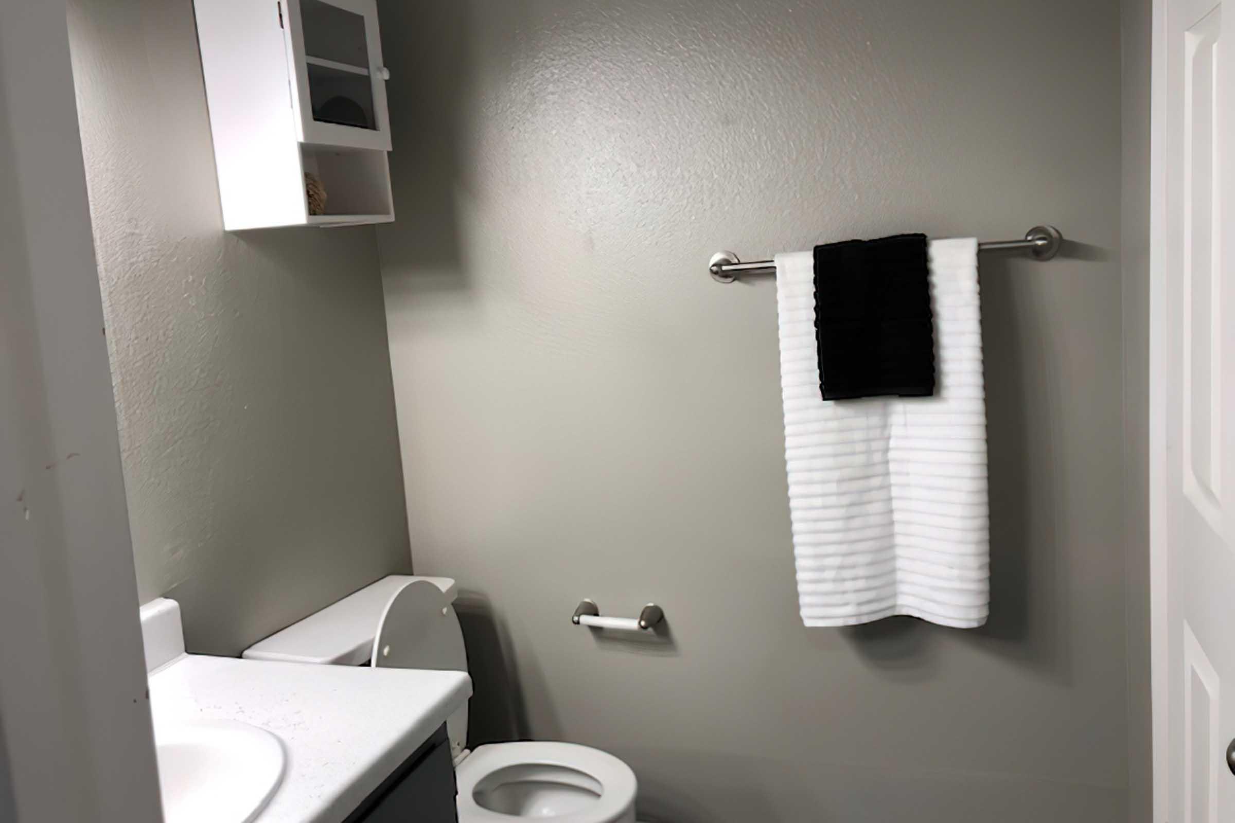 a restroom with a sink and a mirror