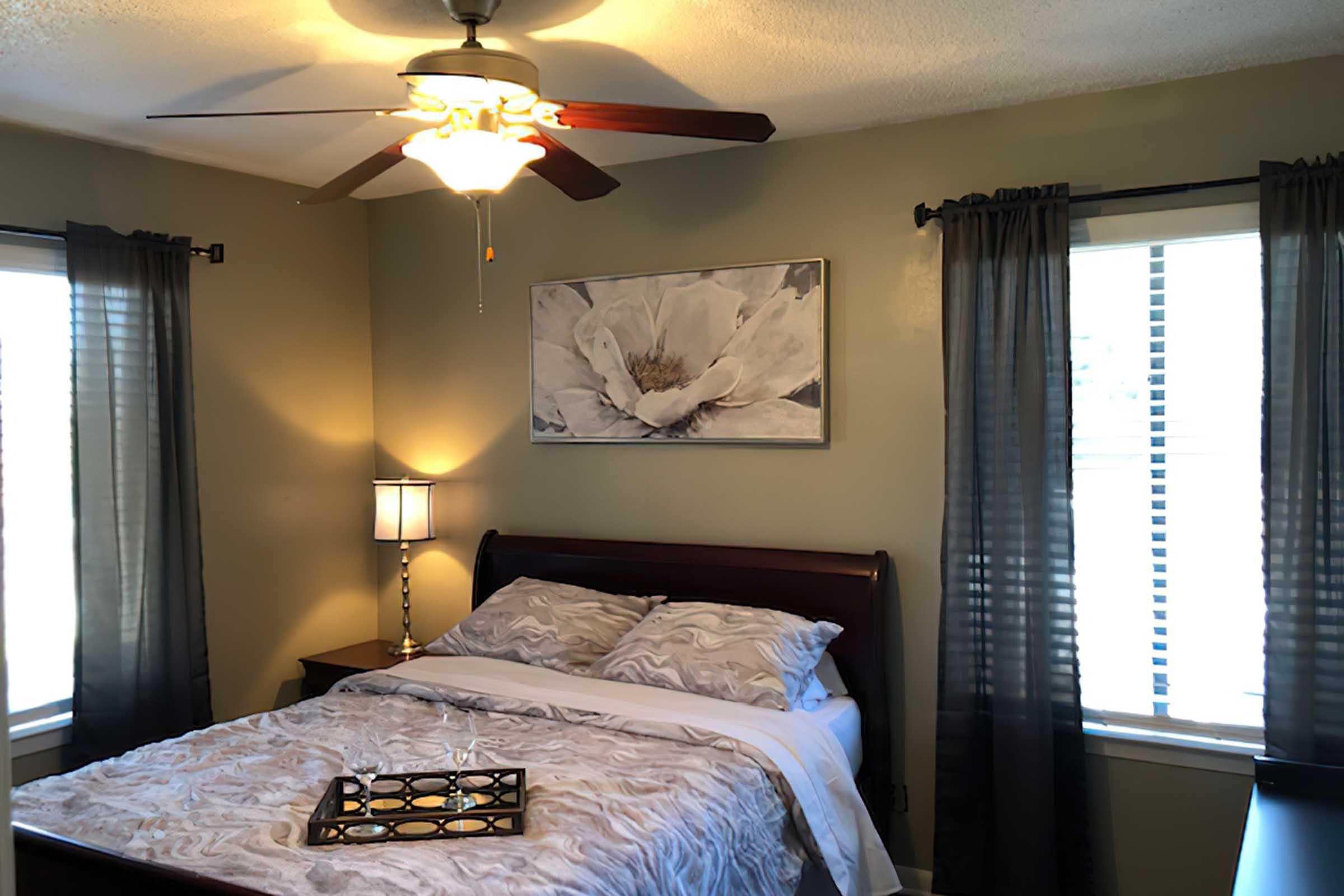 a bedroom with a large bed in a hotel room