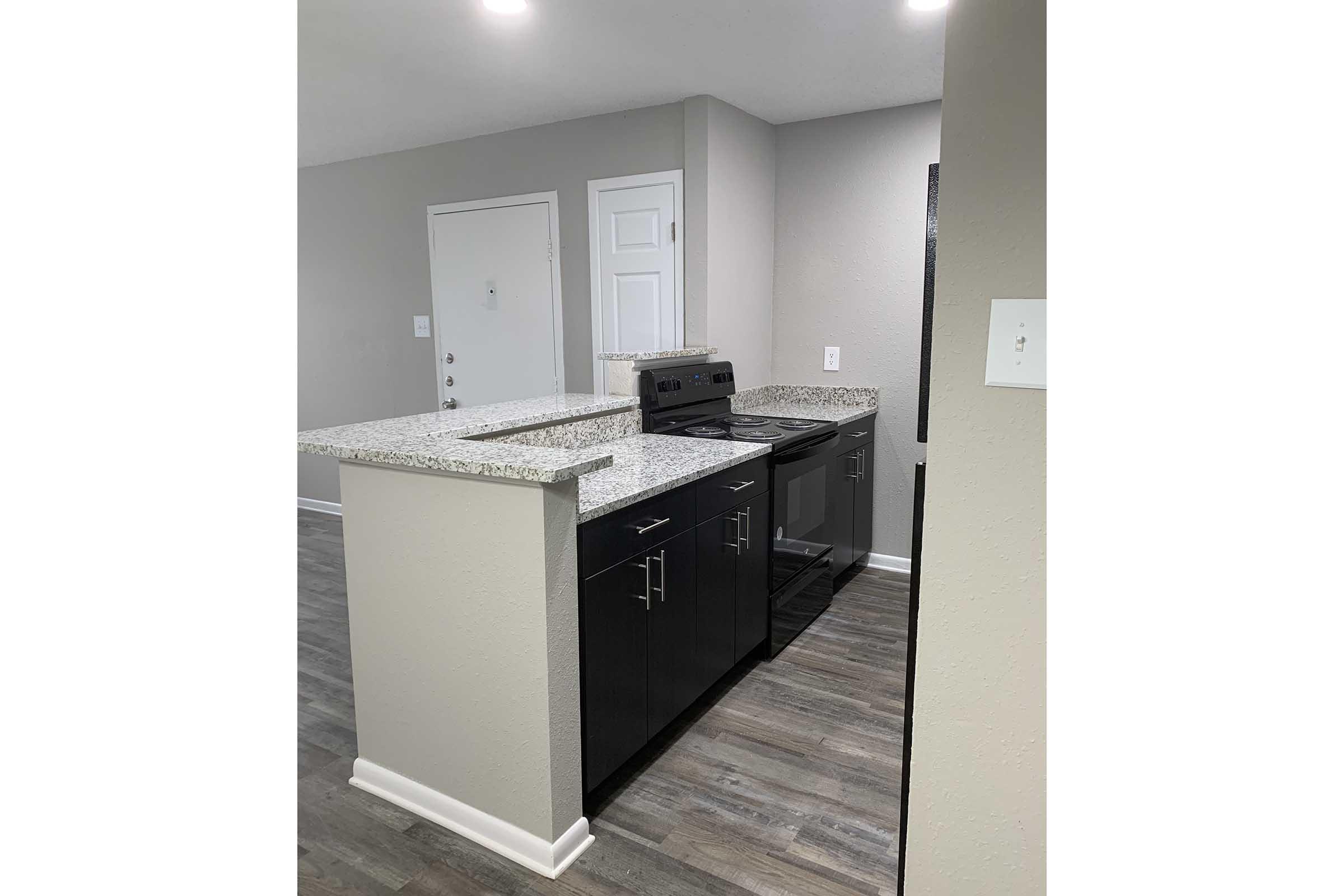 a kitchen with a sink and a refrigerator