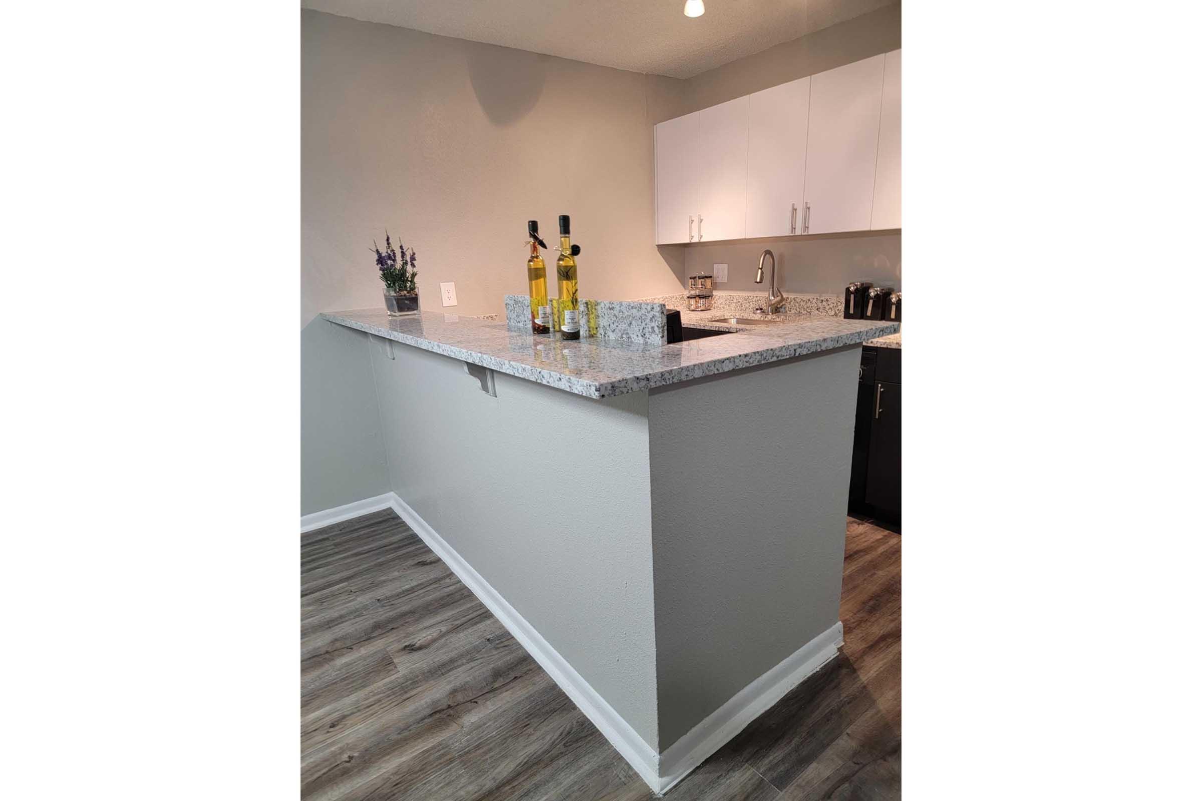 a kitchen with a sink and a refrigerator