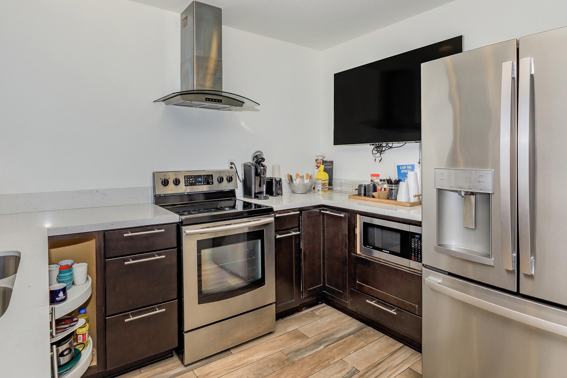 a modern kitchen with stainless steel appliances