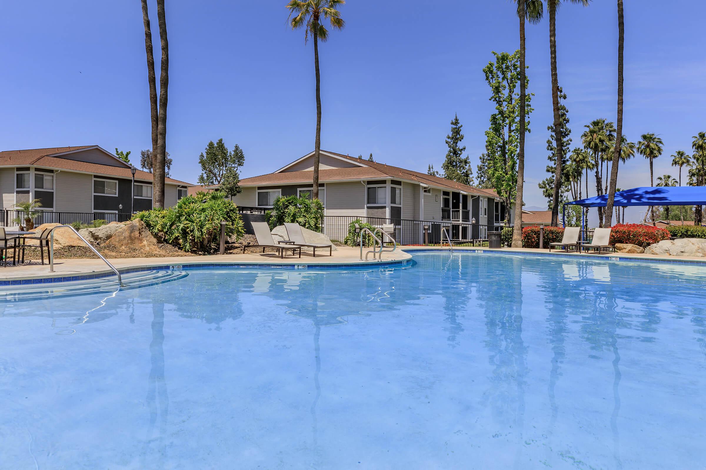 a pool of water in front of a house