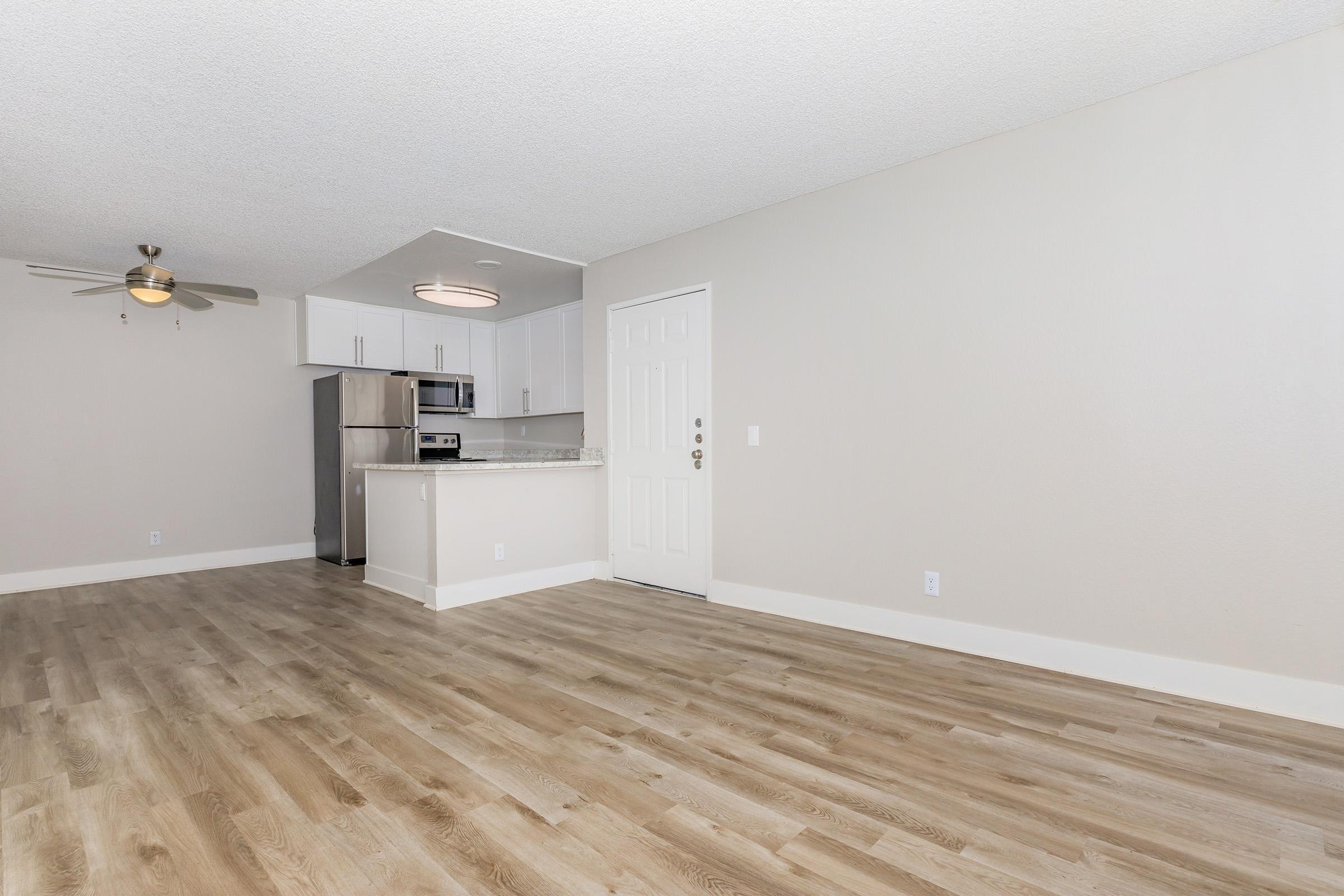 a kitchen with a wooden floor