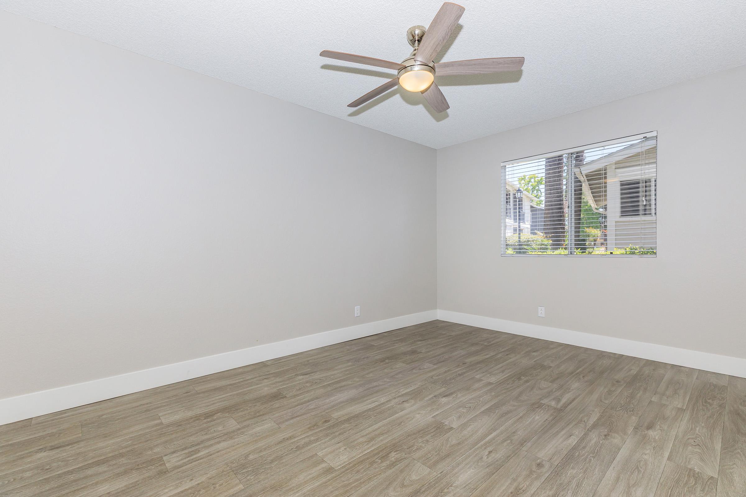 a bedroom with a large window